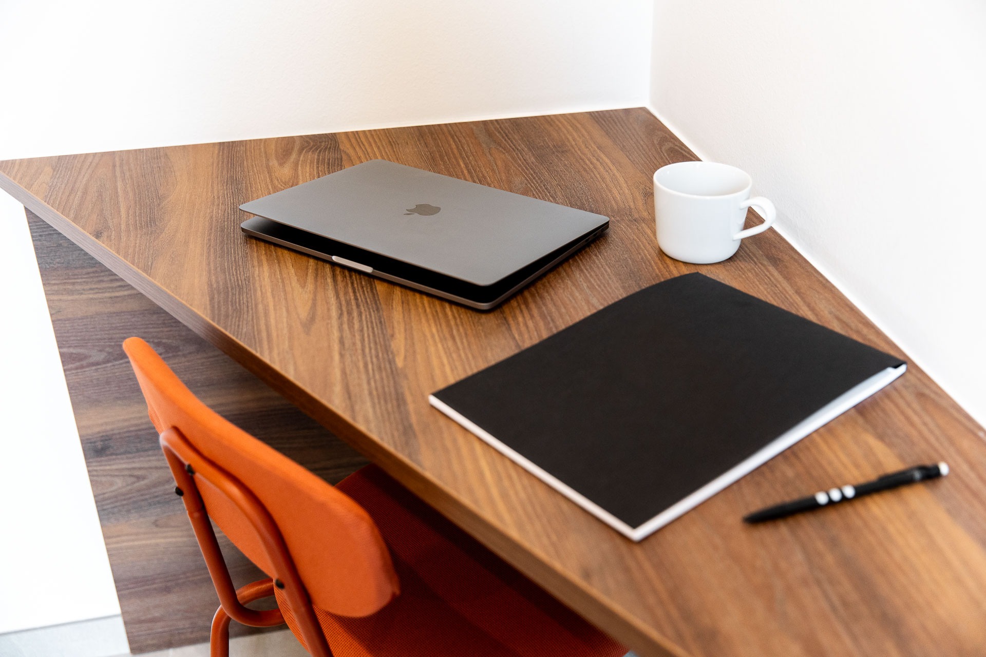a close up of a cell phone laying on top of a pile of gravel