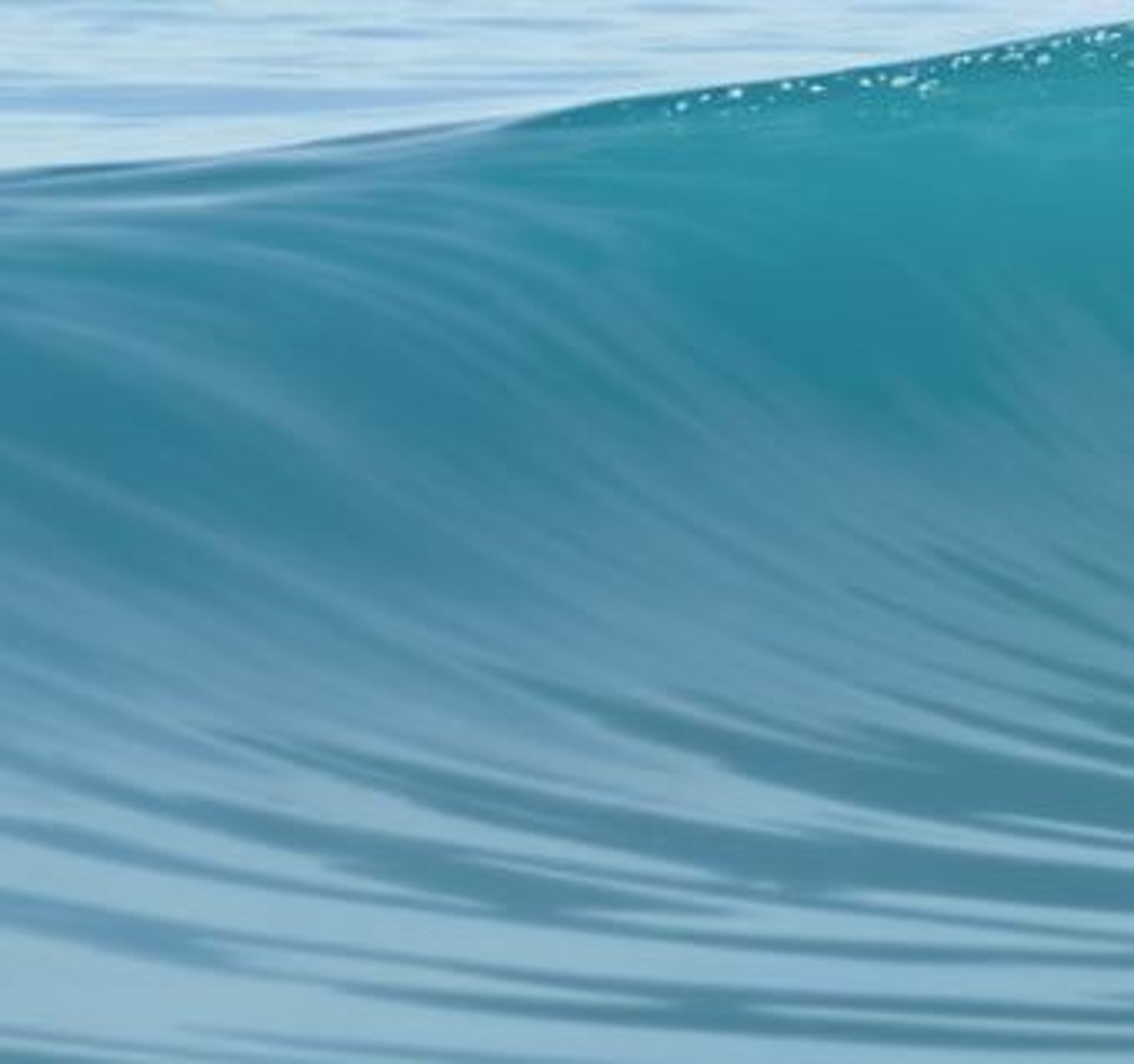 an abstract photo of a curved building with a blue sky in the background