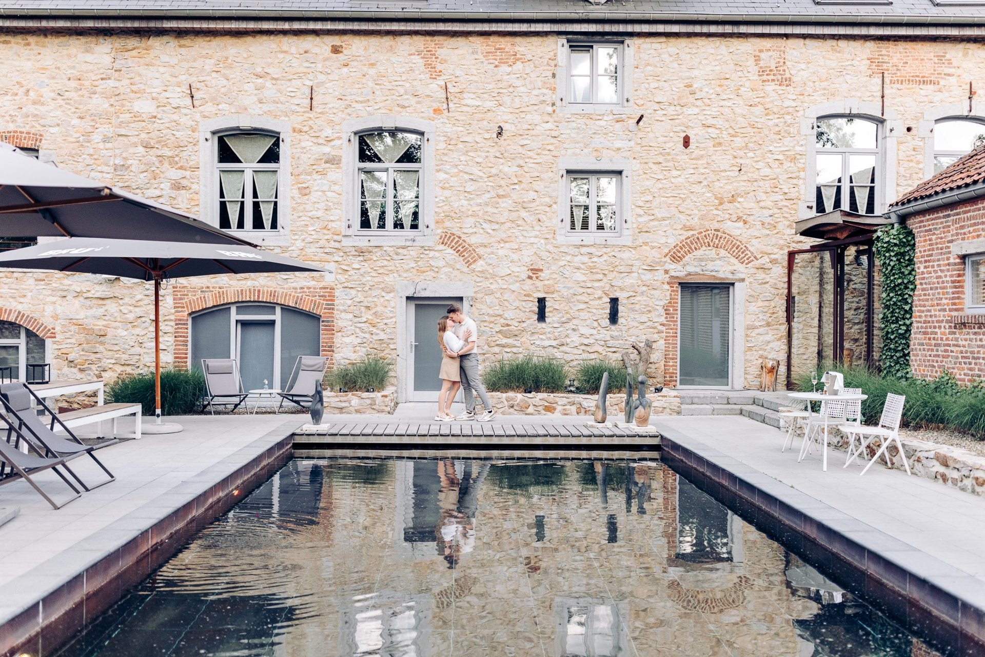 an abstract photo of a curved building with a blue sky in the background