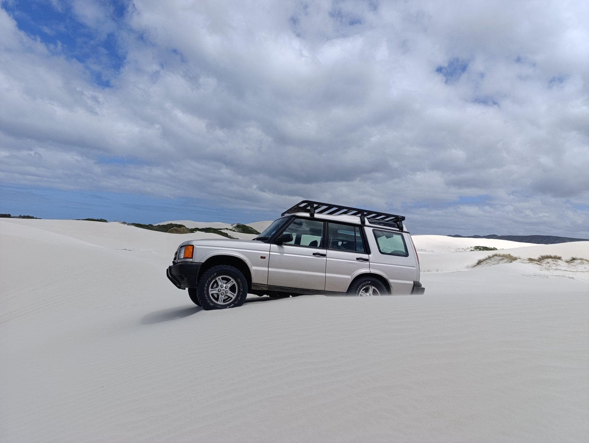 black and brown leather padded tub sofa