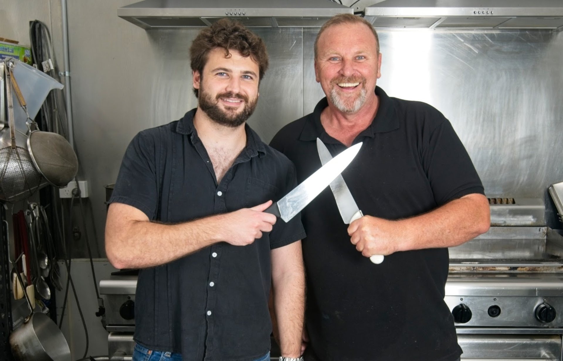 A group of people in a kitchen preparing food