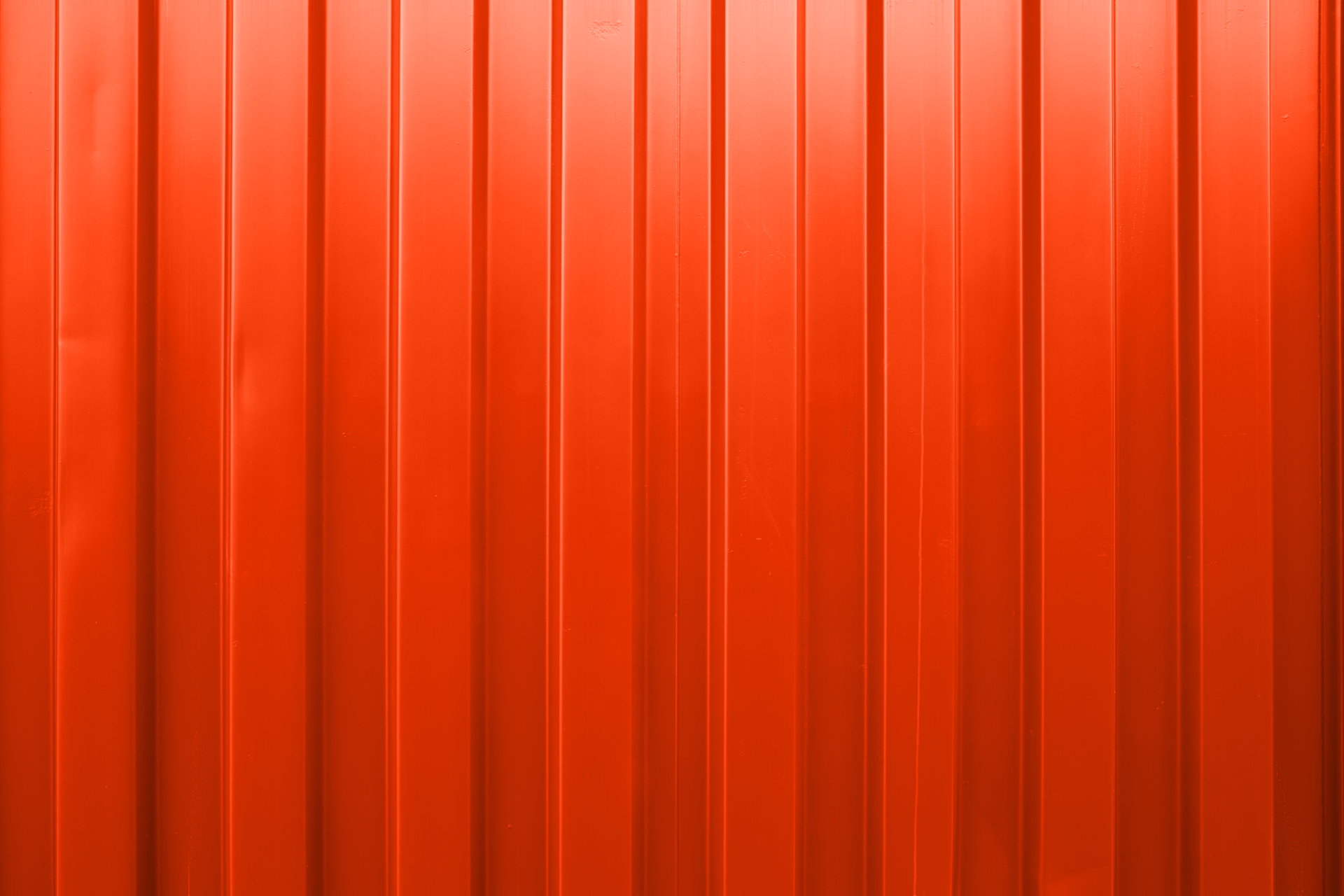 an abstract photo of a curved building with a blue sky in the background