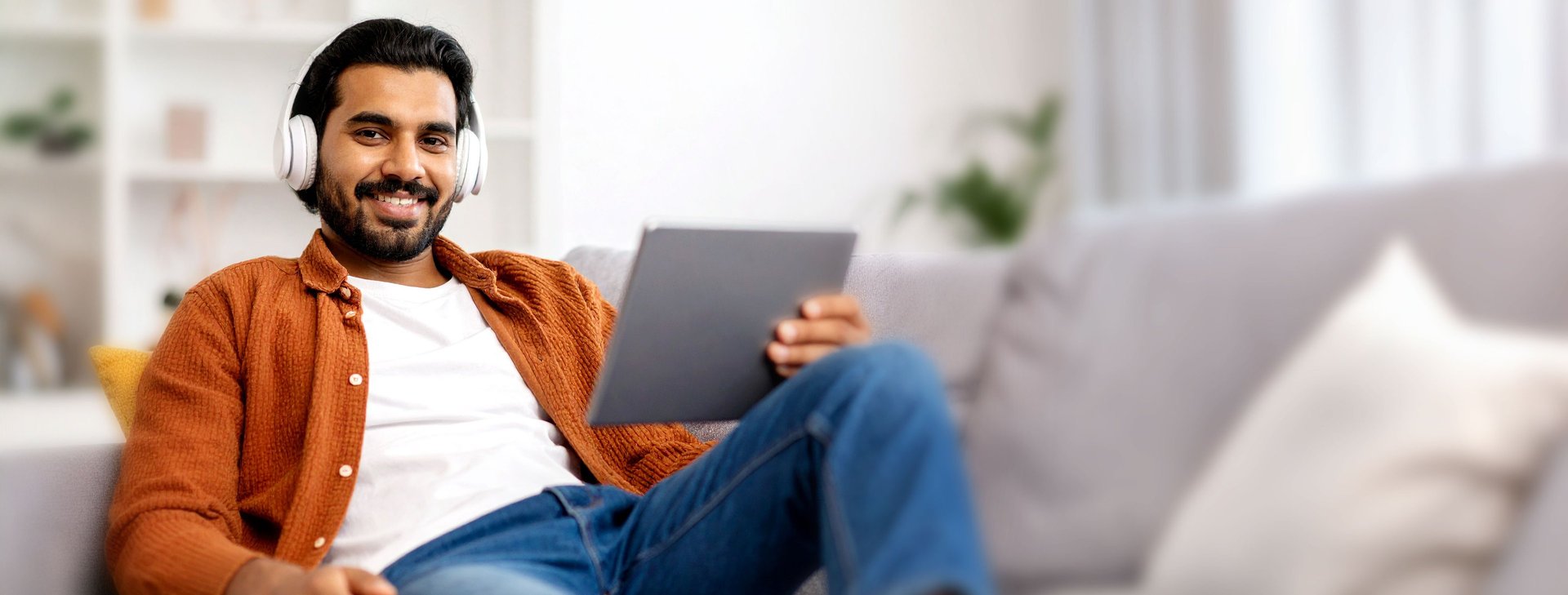 an abstract photo of a curved building with a blue sky in the background