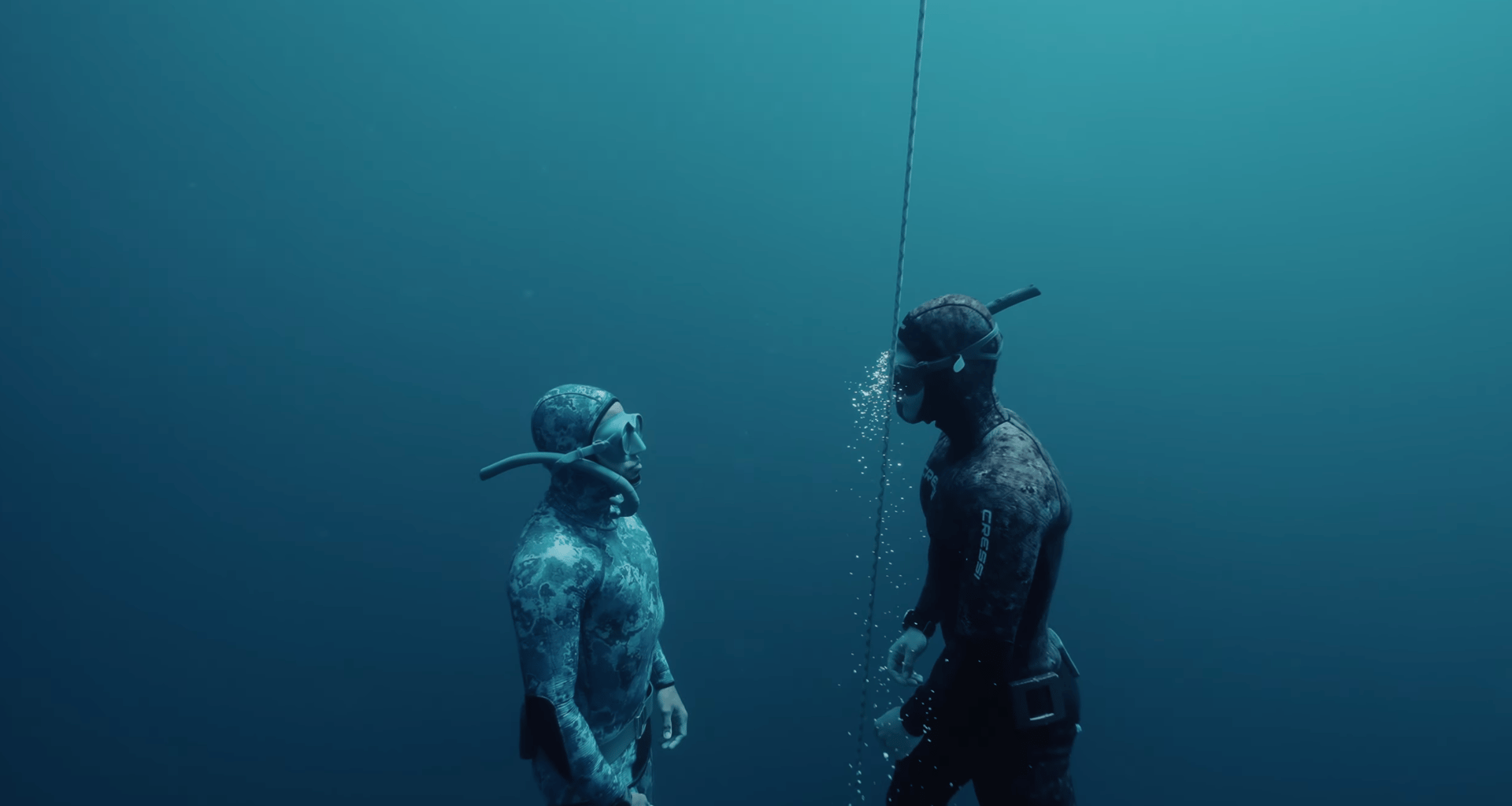 an abstract photo of a curved building with a blue sky in the background