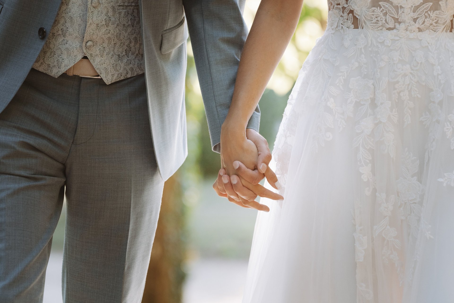 gold wedding band on white textile