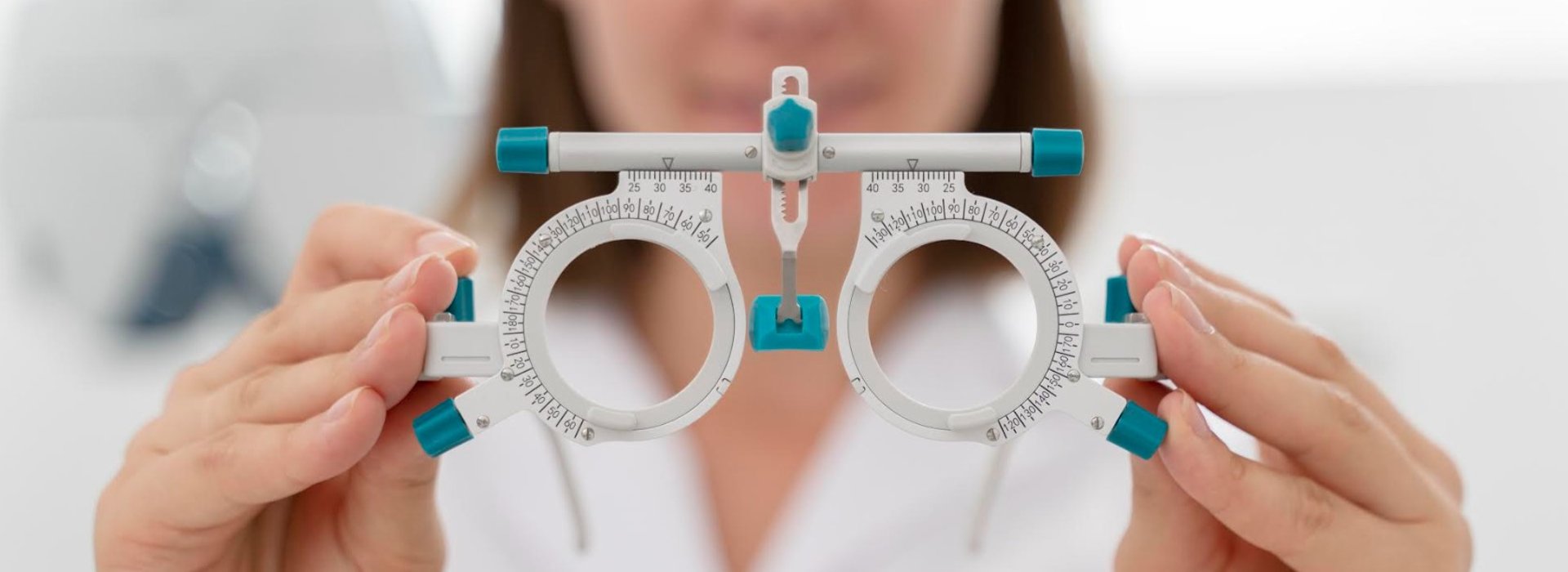 a group of different colored buttons on a pink surface