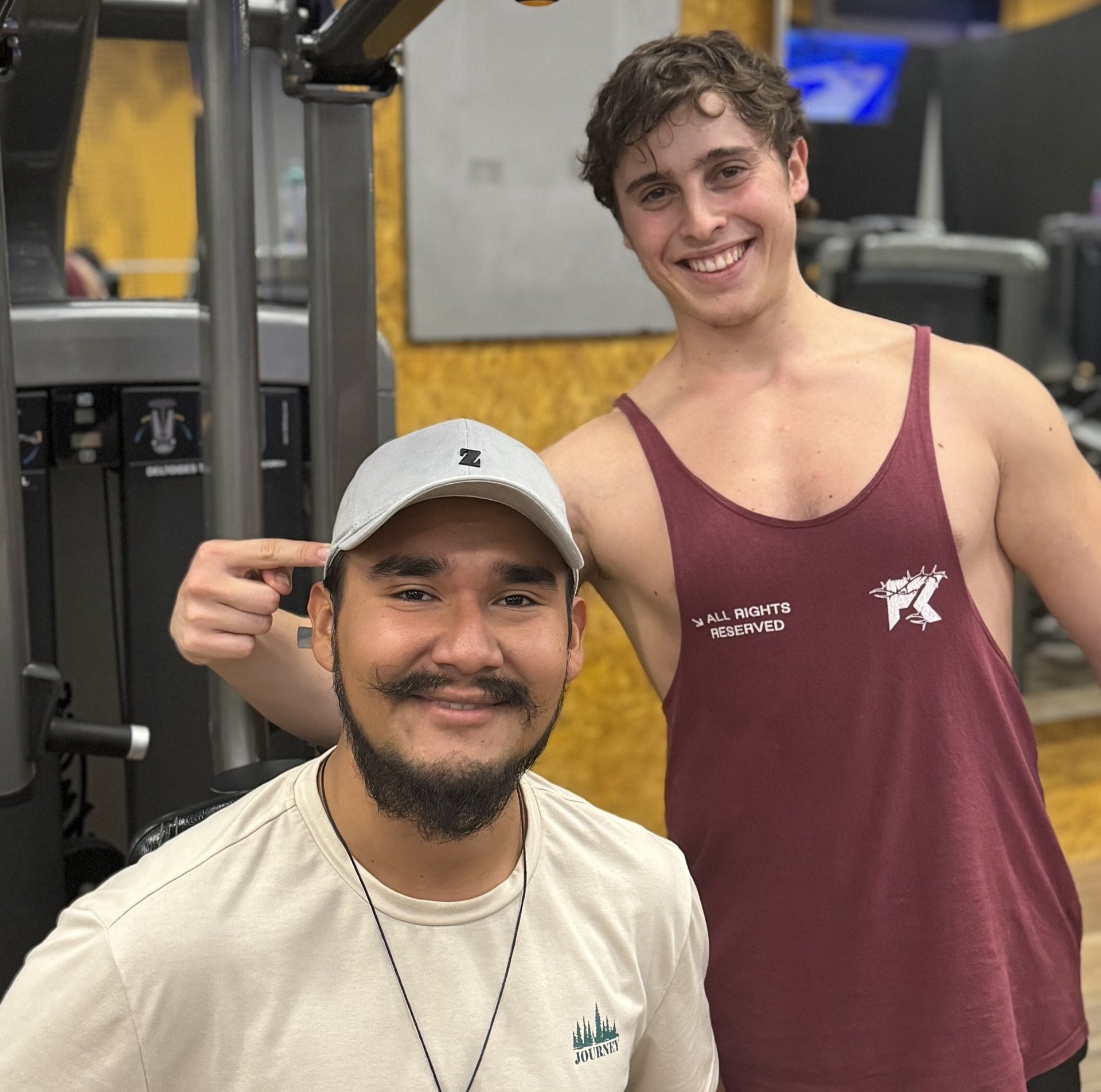 three person lifting barbels