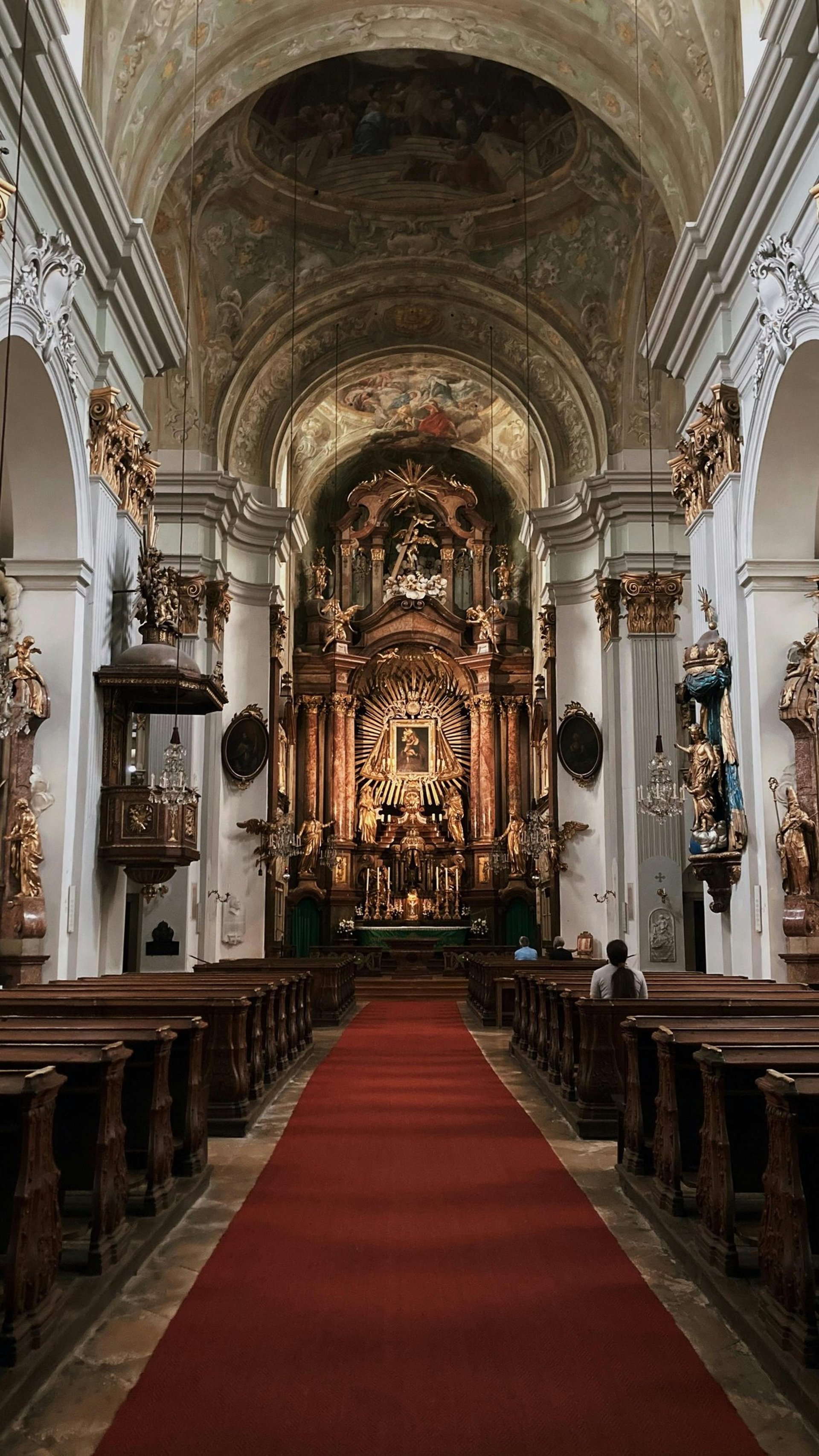 silhouette photography of two coconut trees near body water during golden hour
