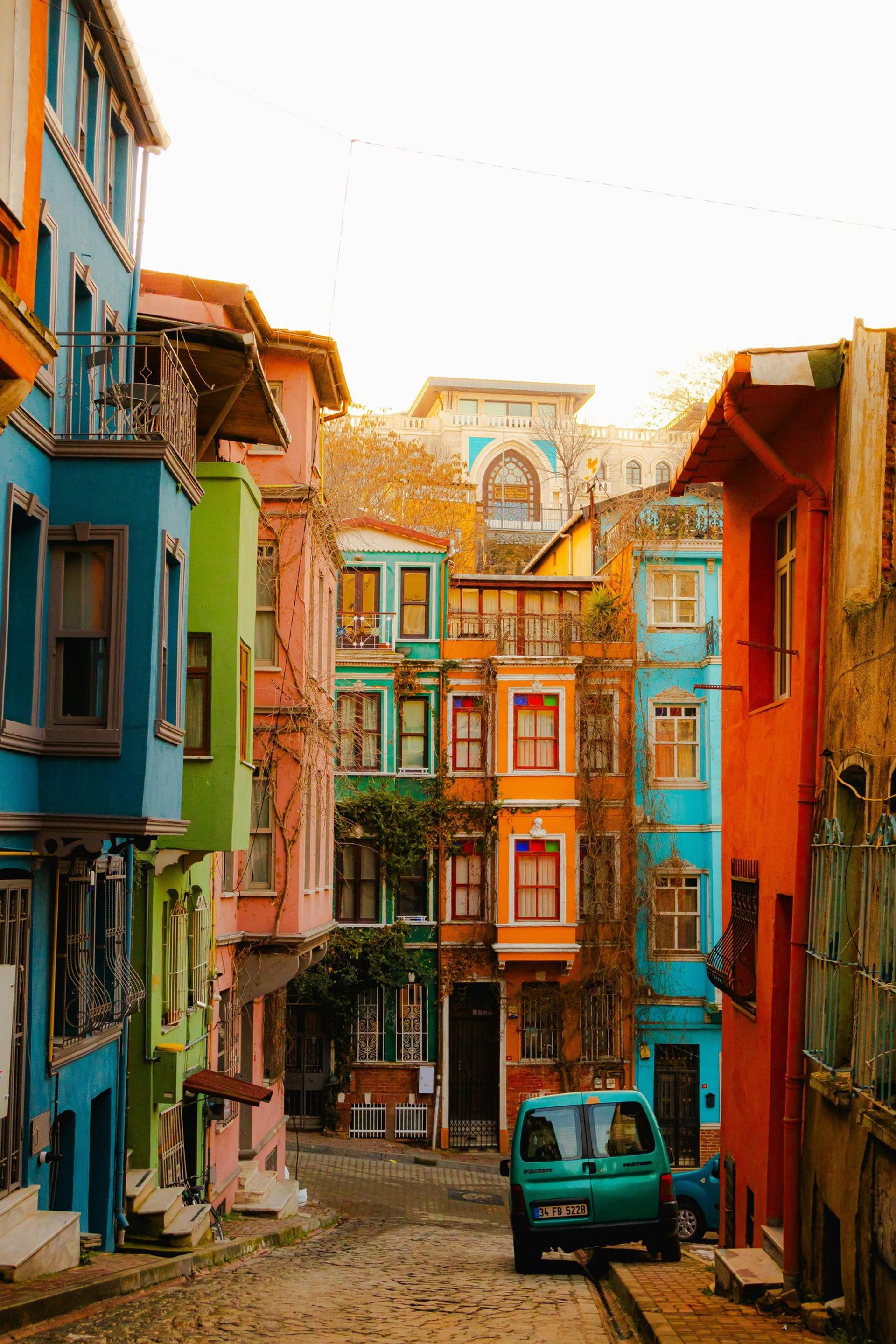 silhouette photography of two coconut trees near body water during golden hour