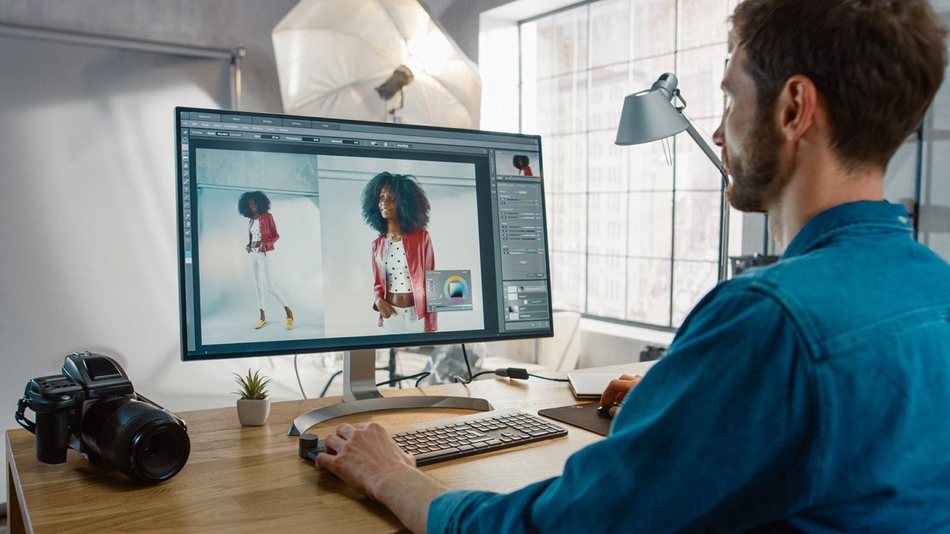person using computer setup on white desk