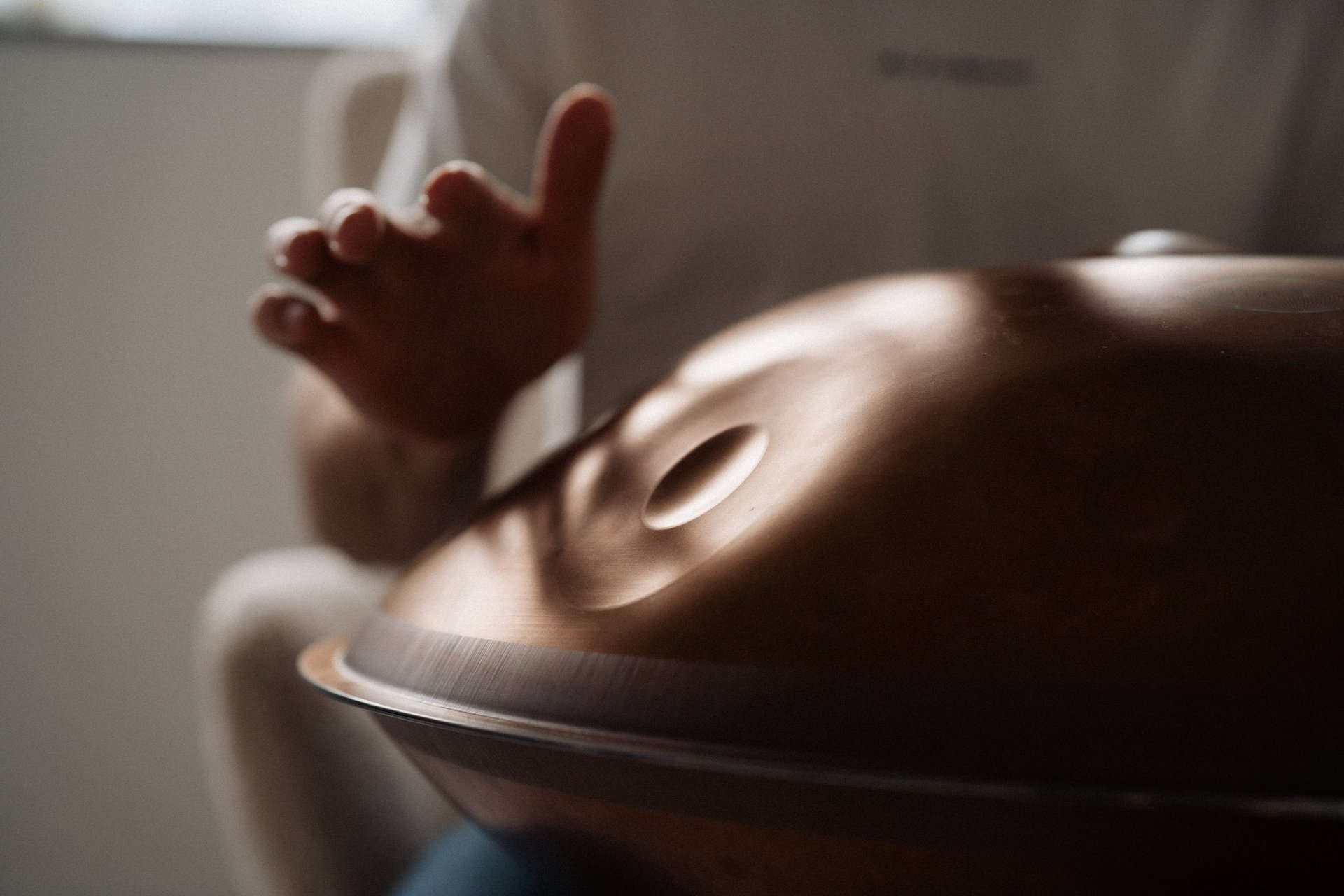 an abstract photo of a curved building with a blue sky in the background