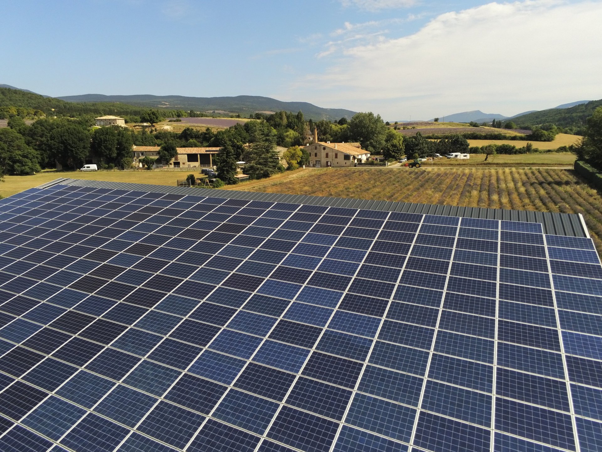 an abstract photo of a curved building with a blue sky in the background