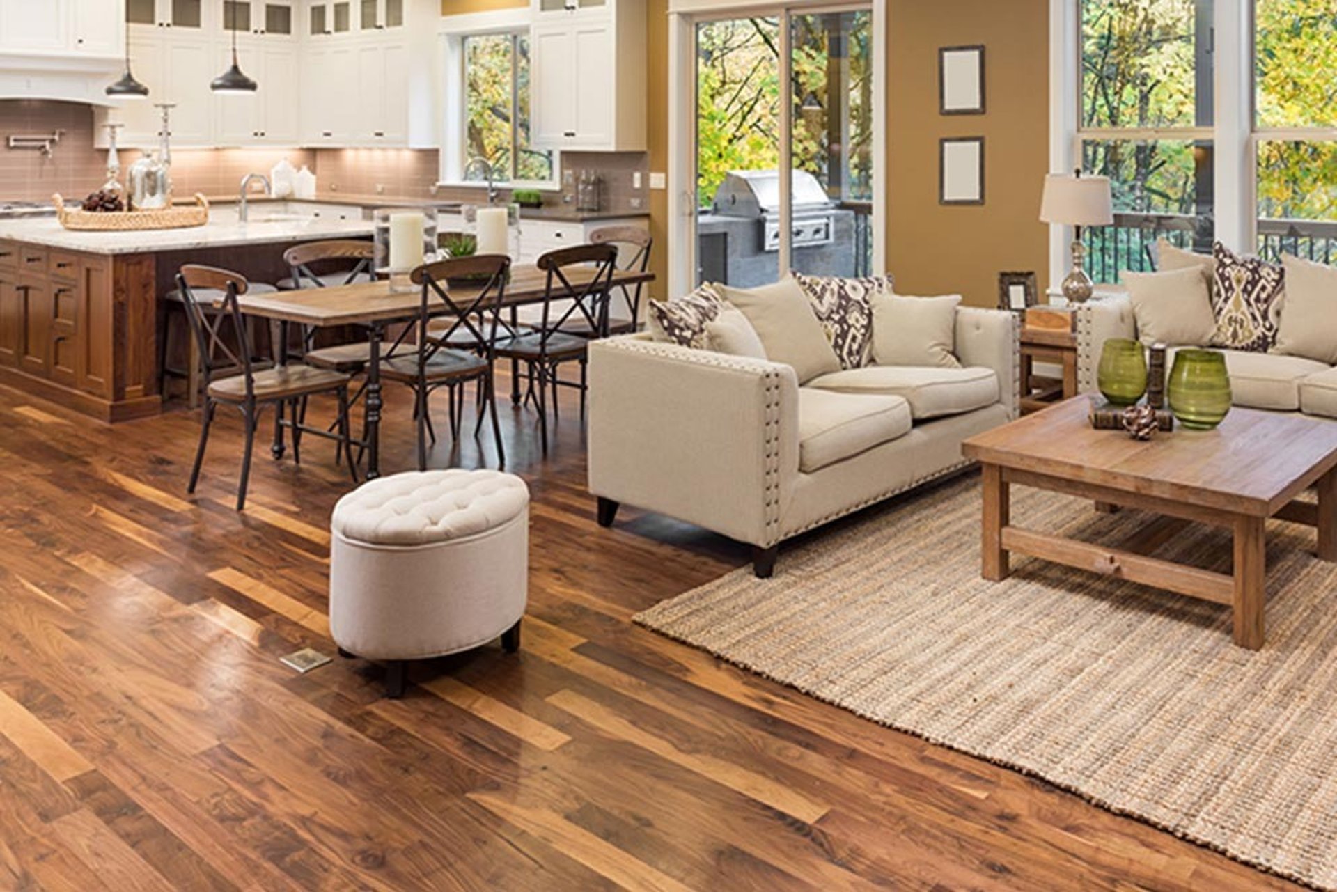 Man sitting under umbrella next to motorcycle