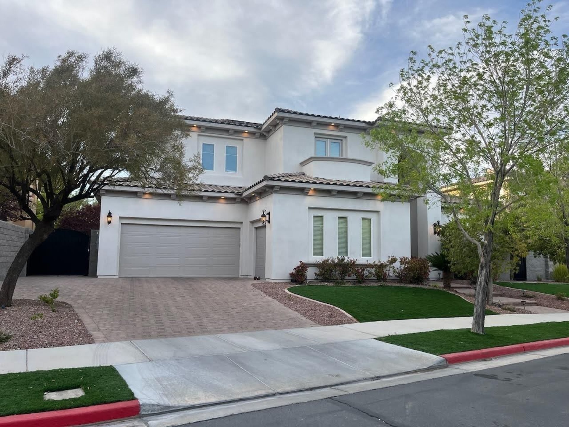 Man sitting under umbrella next to motorcycle