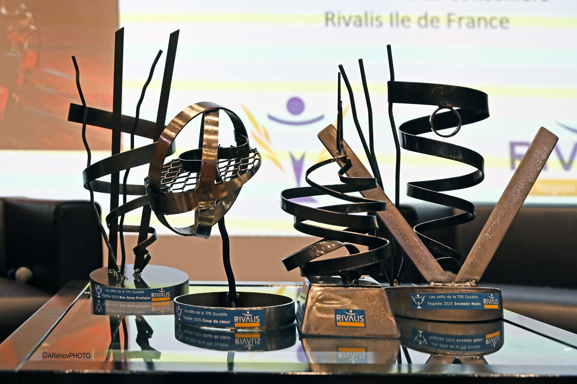 crowd of people sitting on chairs inside room