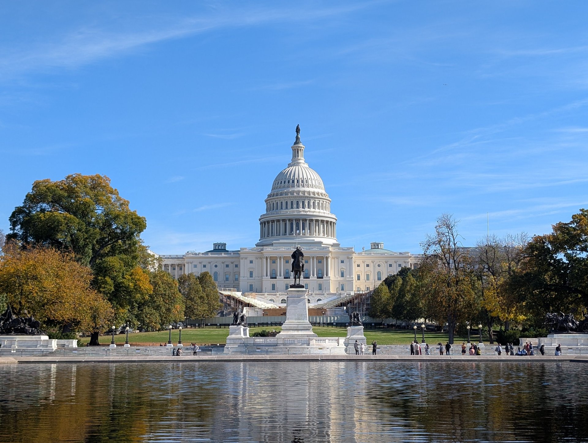 woman wearing yellow long-sleeved dress under white clouds and blue sky during daytime