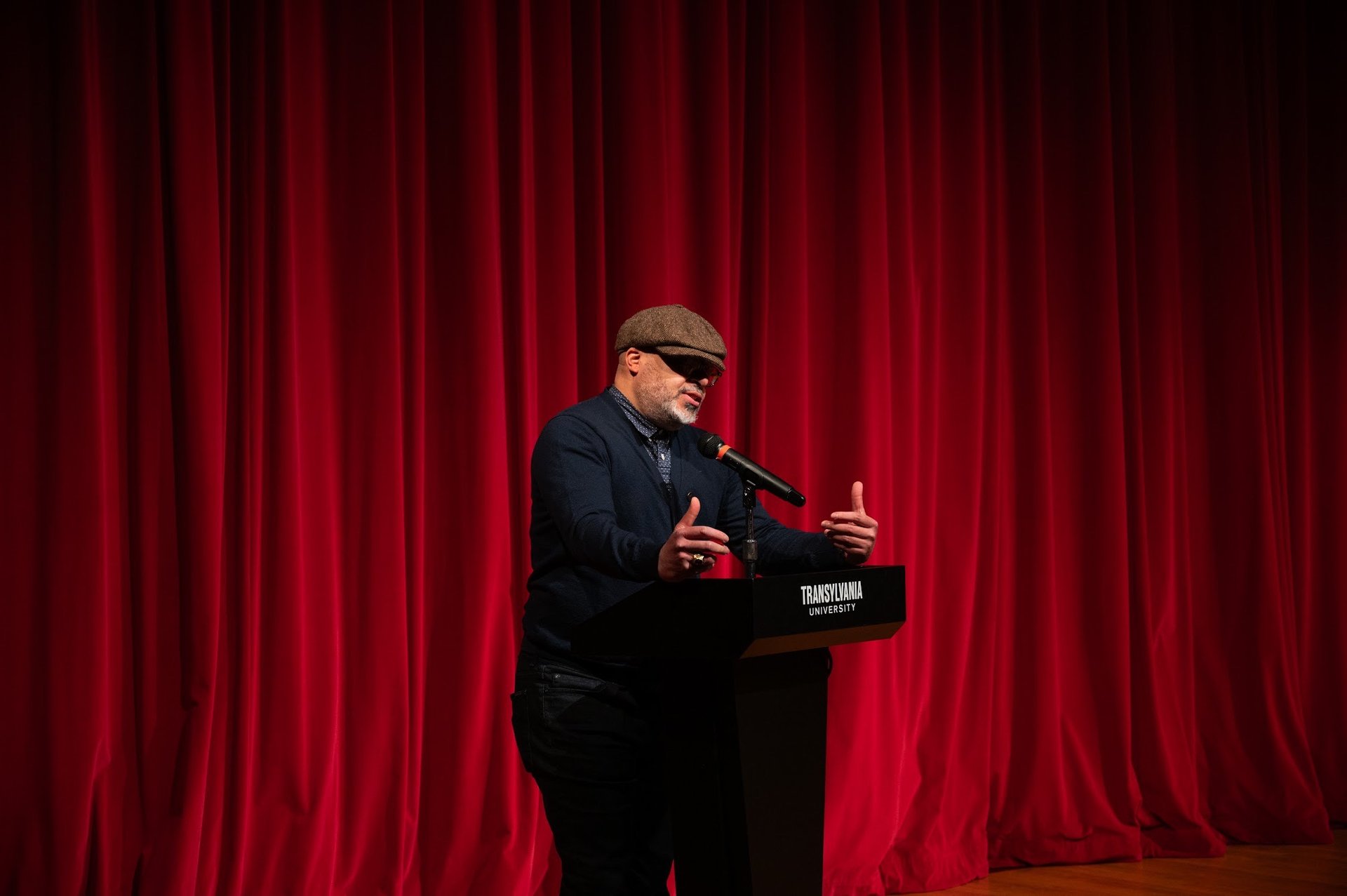 a microphone with a band in the background