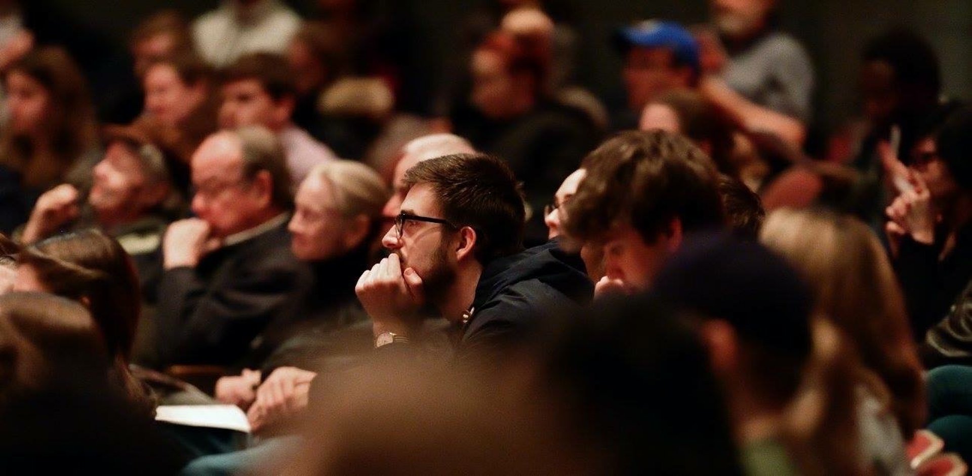 an abstract photo of a curved building with a blue sky in the background