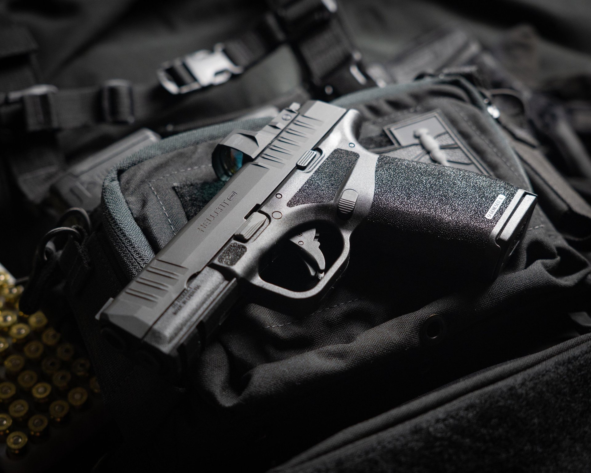 a close up of a gun on a black surface