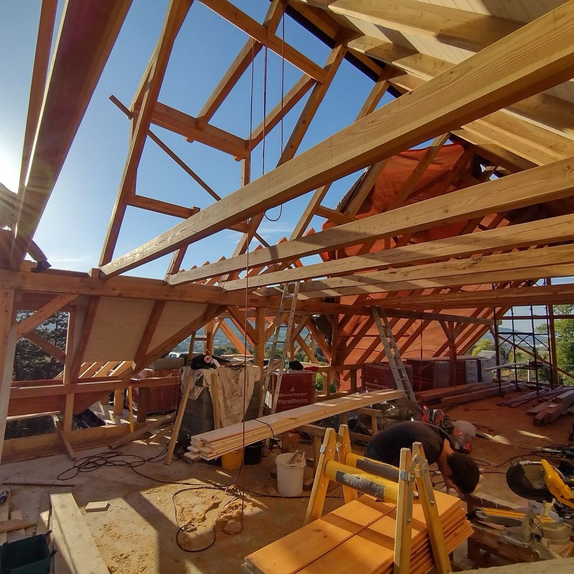 woman wearing yellow long-sleeved dress under white clouds and blue sky during daytime