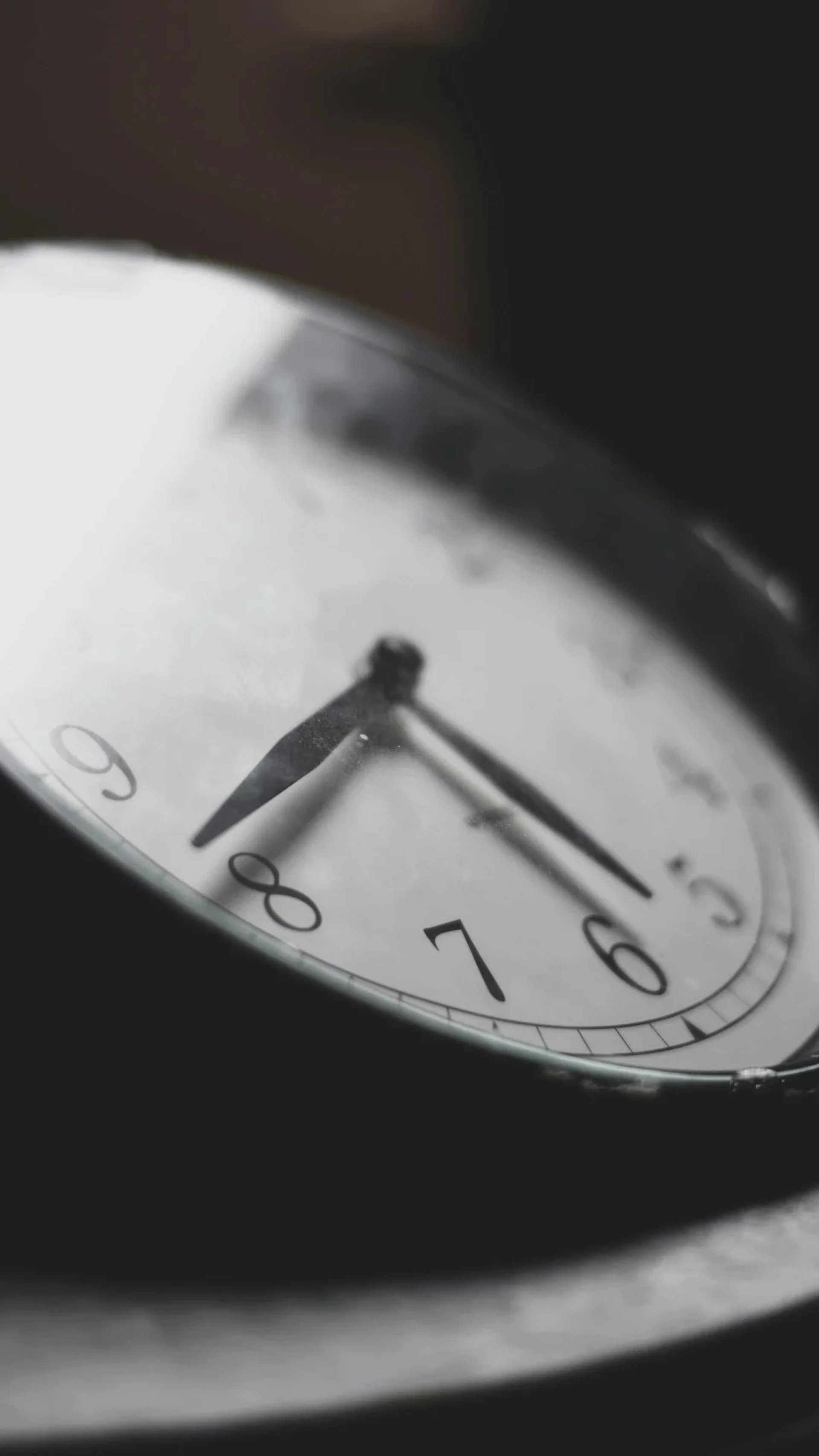 a close up of a clock on a table