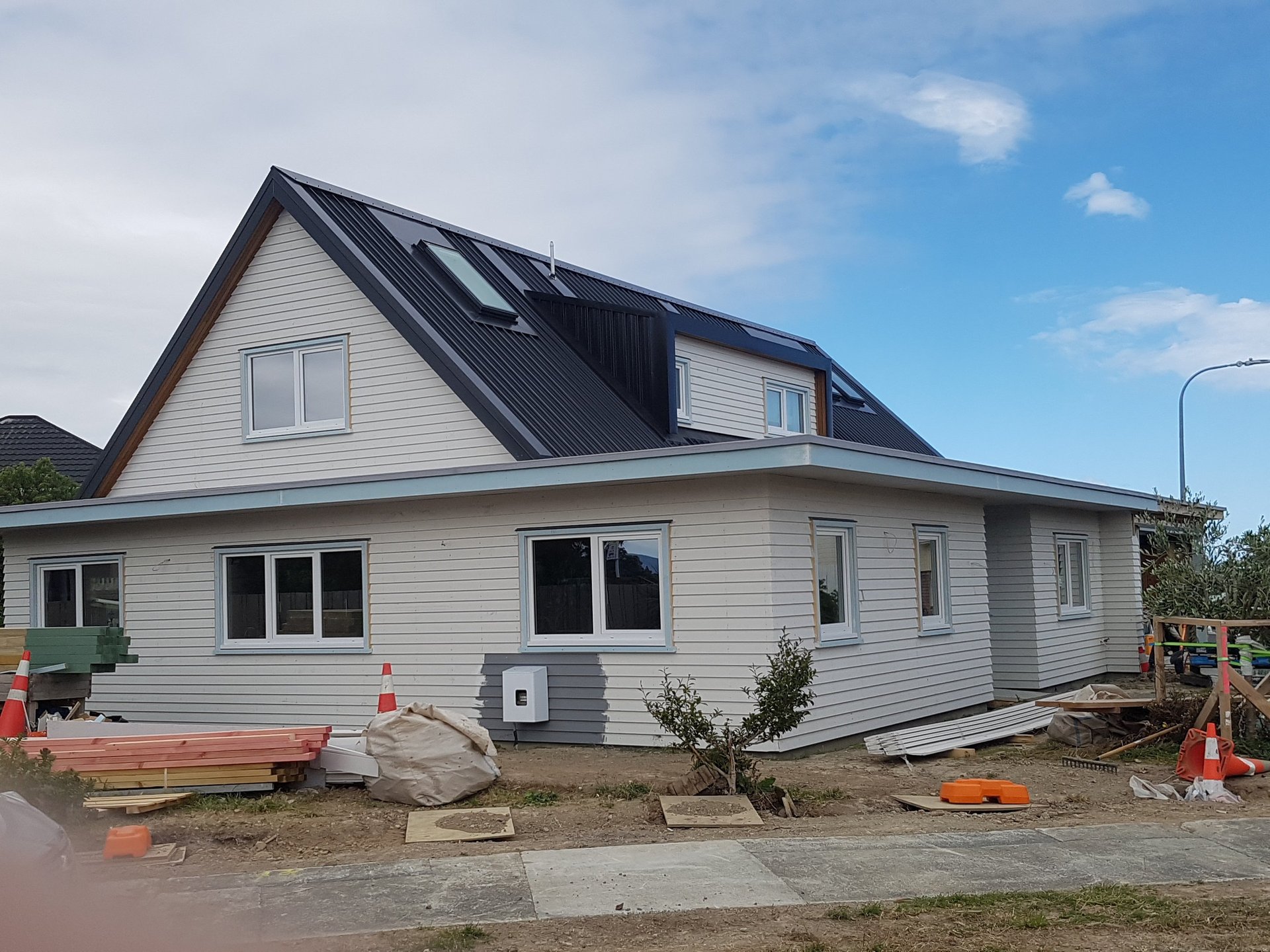 Home renovation in progress with new cladding and roofing—preparing your home for winter with essential upgrades to stay warm