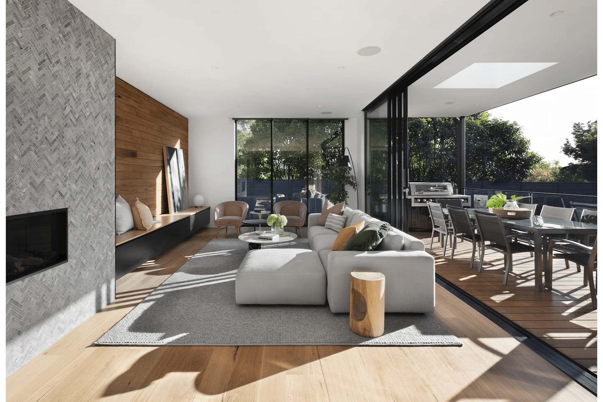 Modern open-plan living room and deck built by Peaky Builders