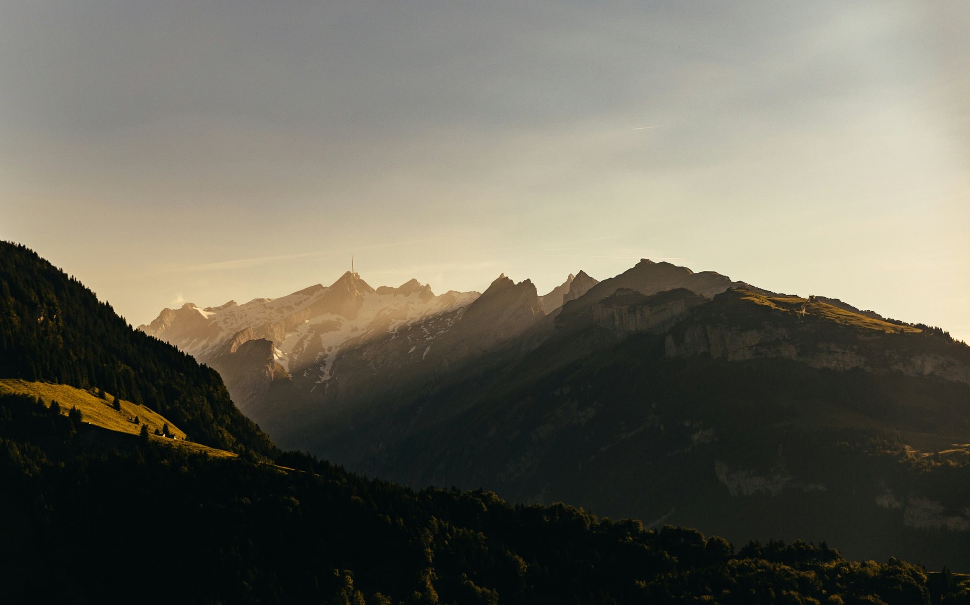 mountains under white mist at daytime