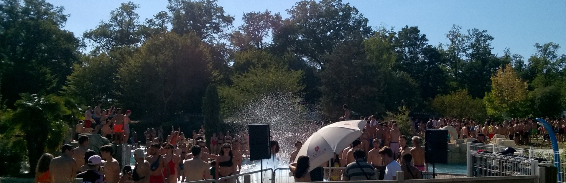 an abstract photo of a curved building with a blue sky in the background