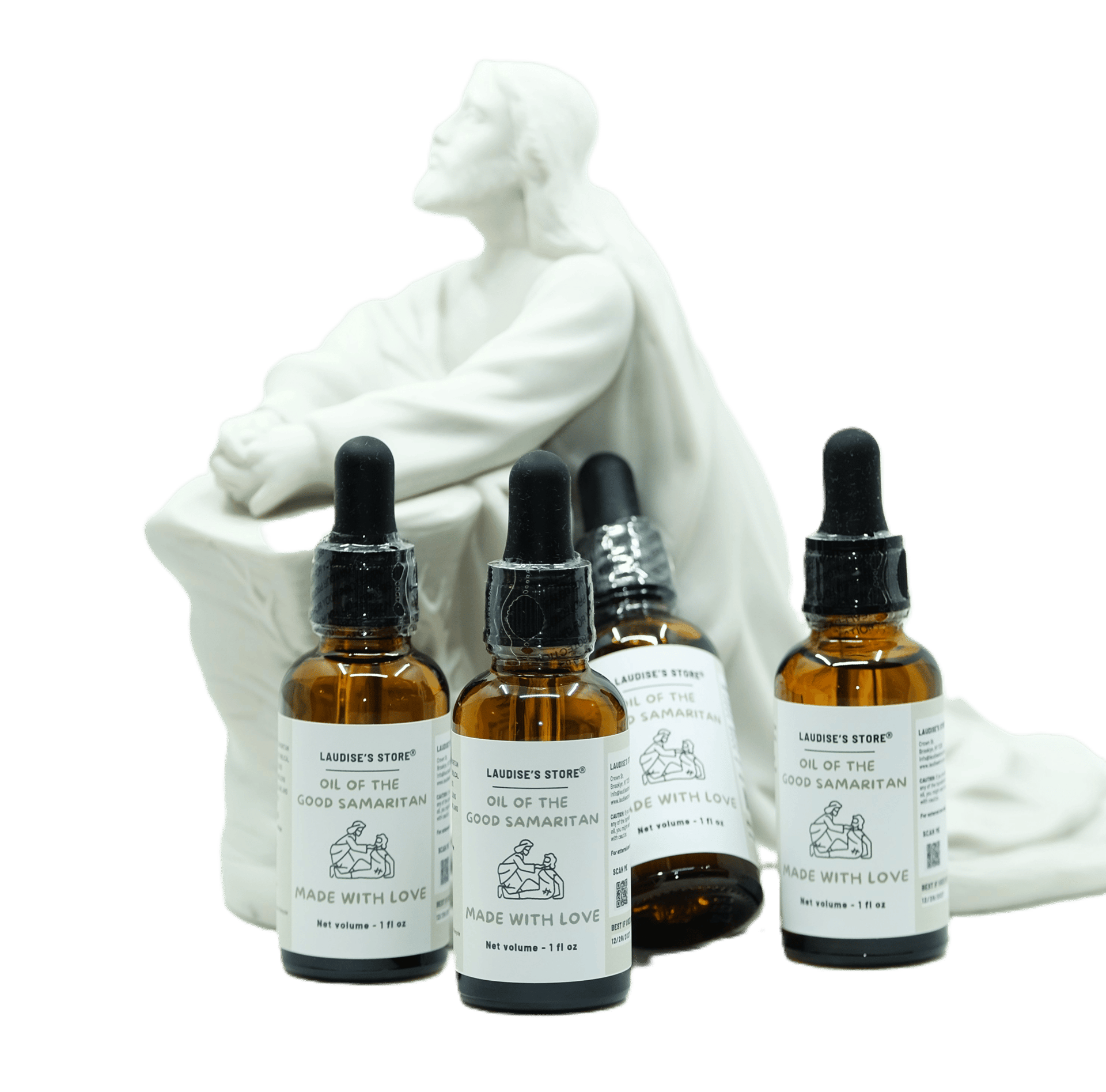 Two bottles of oil of St Michael the Archangel, standing next to a statue of Jesus