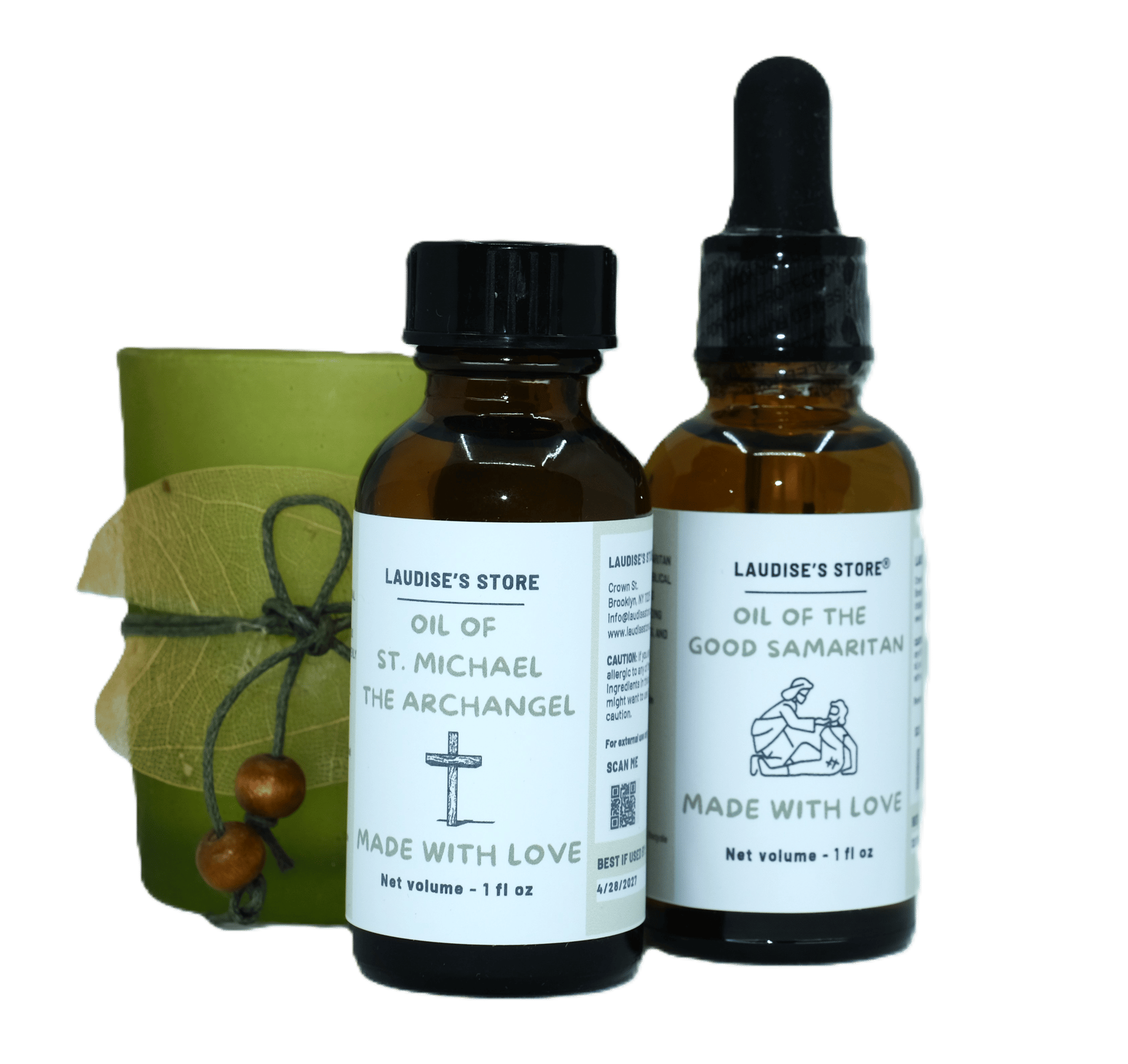 Two bottles of oil of St Michael the Archangel, standing next to a statue of Jesus