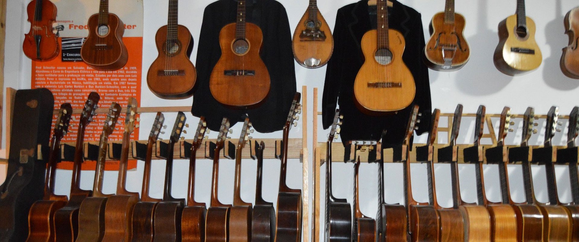 closeup photo of hanged guitars