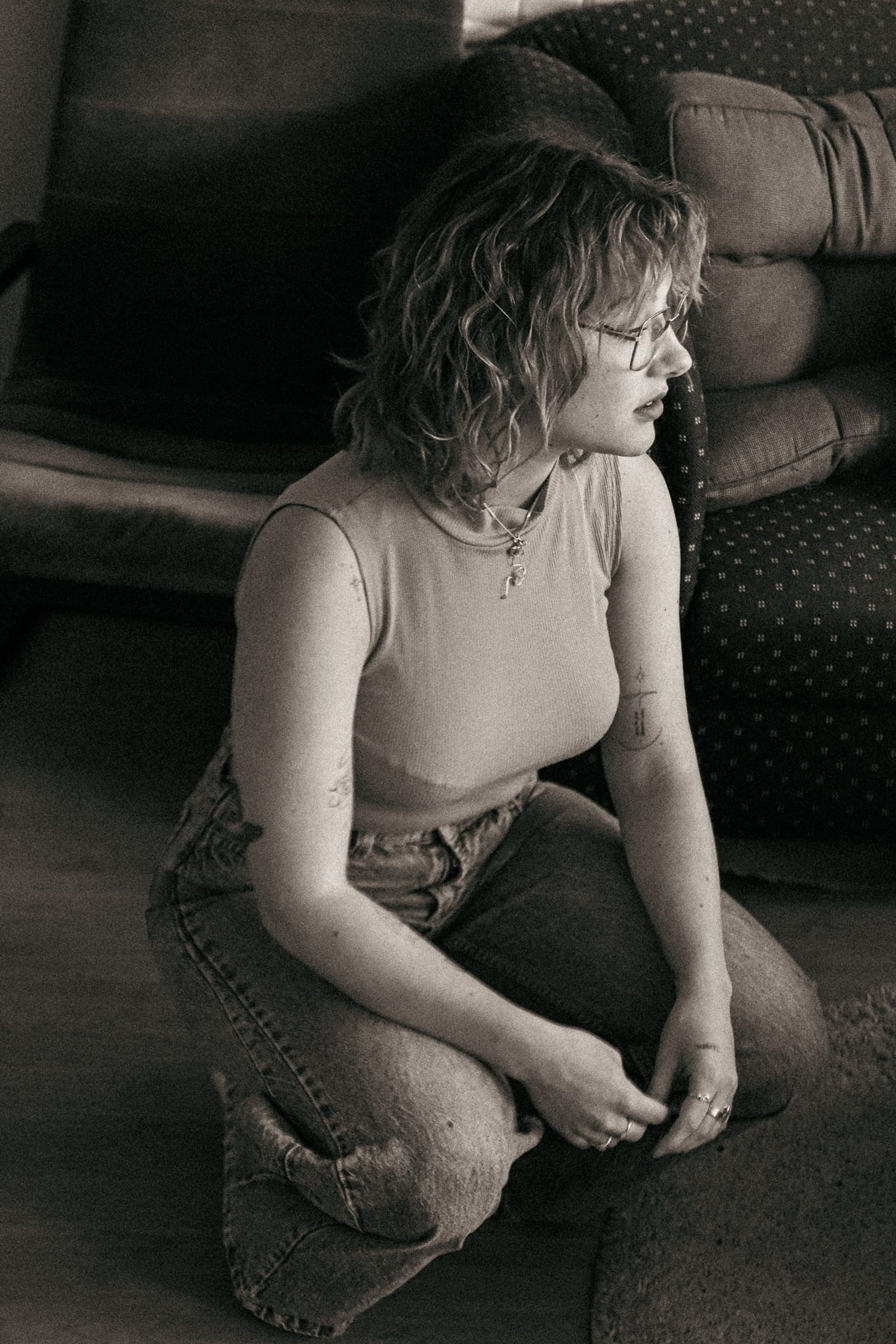 black and brown leather padded tub sofa