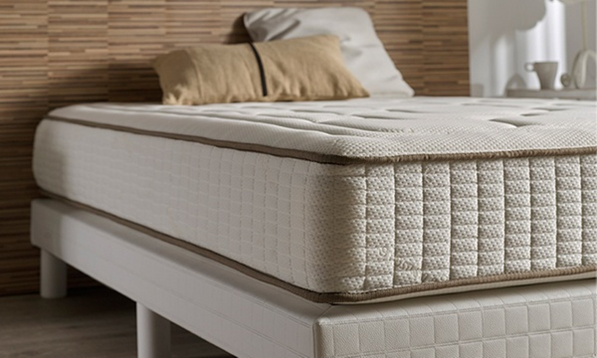 black sconce beside white bed