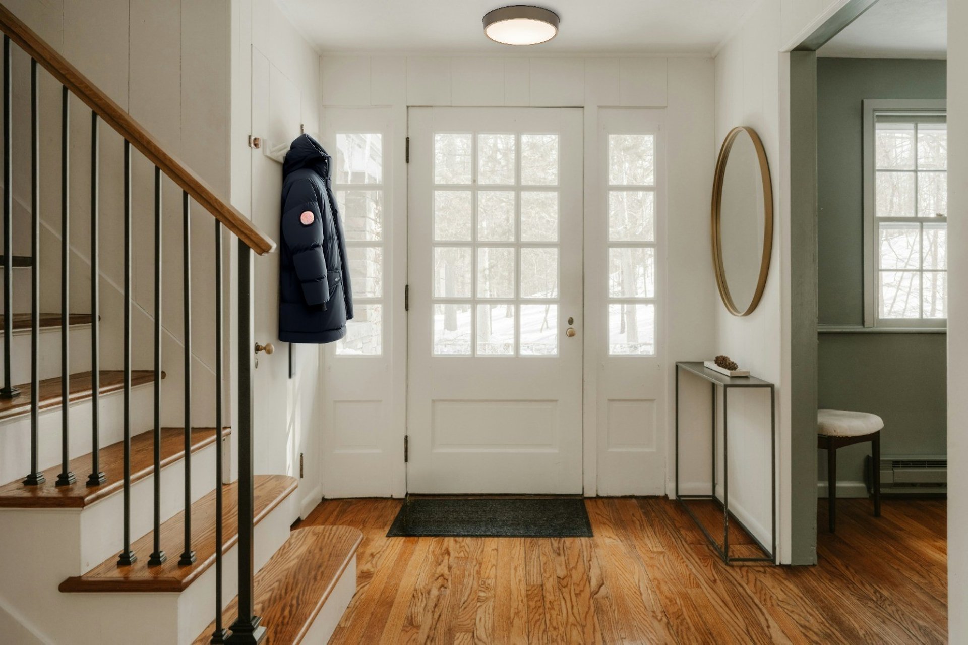 Modern buildings framed by tall trees