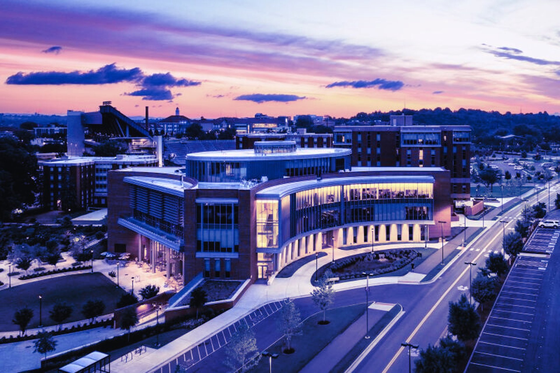 Modern brick and glass academic building at James Madison University’s College of Business, featuring large windows, clean li