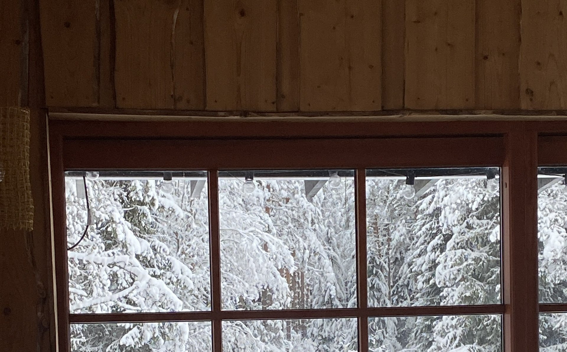 turned-off MacBook Pro between cup of coffee, iPhone, notebook, and pen