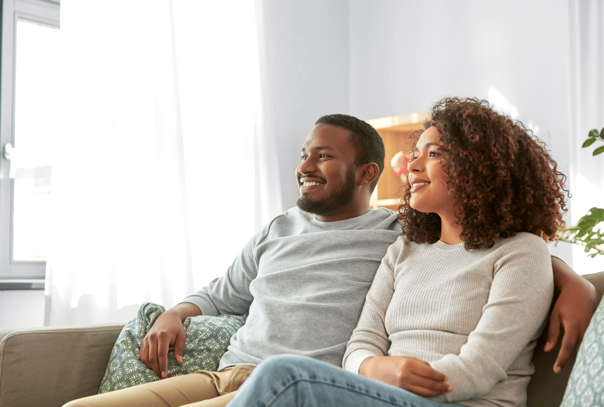 an abstract photo of a curved building with a blue sky in the background