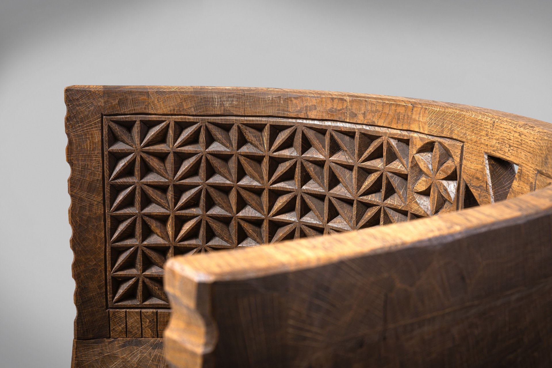 an abstract photo of a curved building with a blue sky in the background