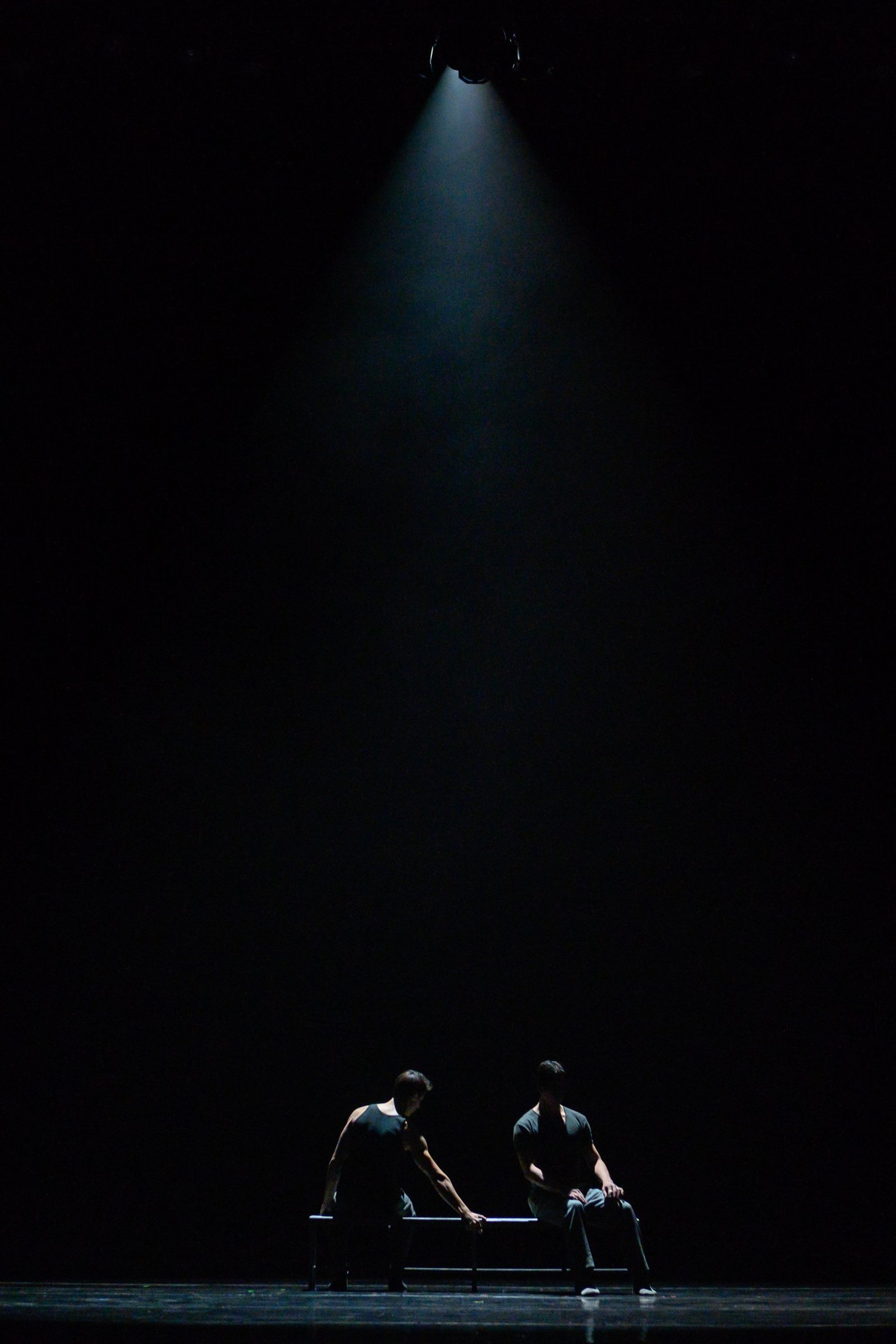 an abstract photo of a curved building with a blue sky in the background