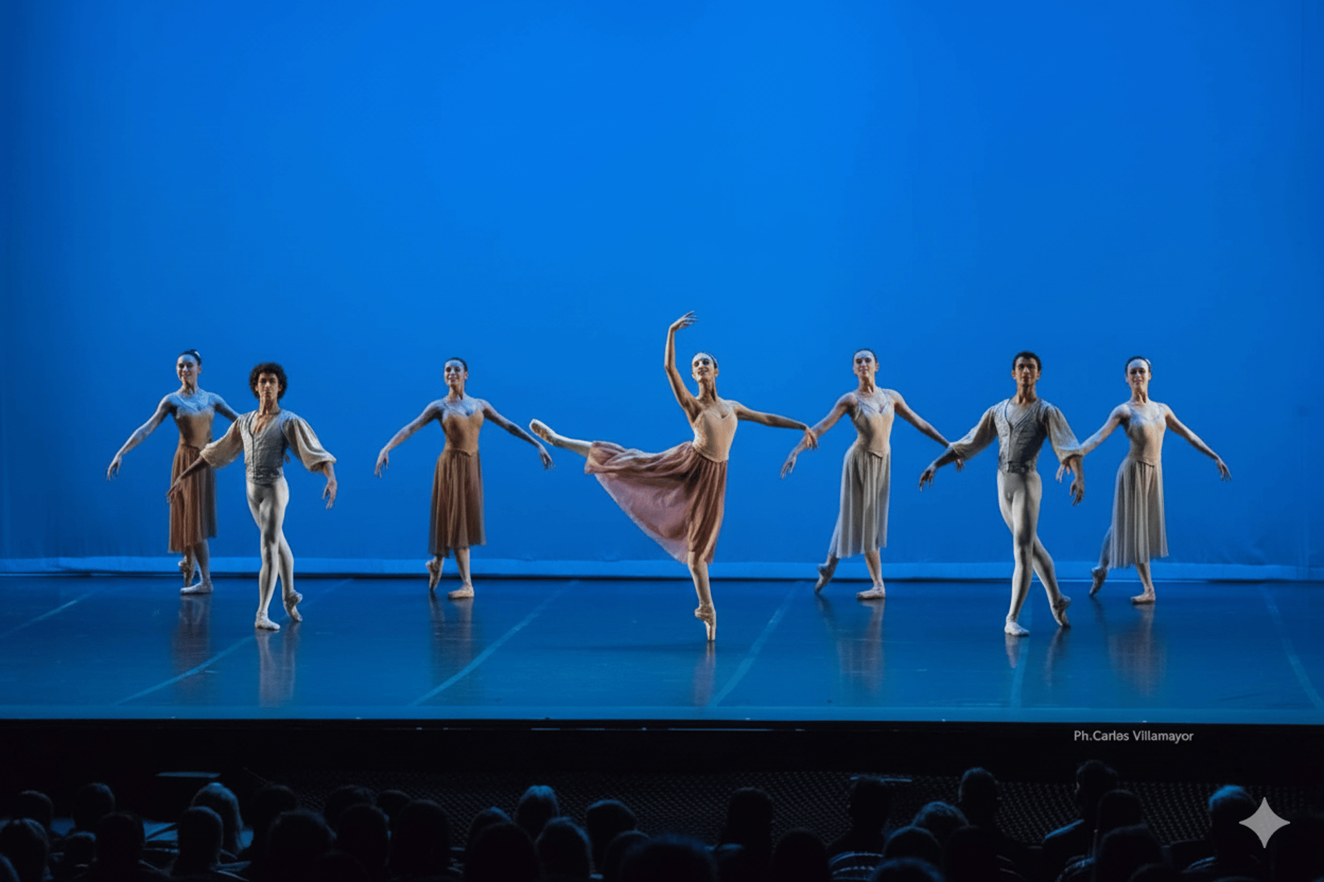 an abstract photo of a curved building with a blue sky in the background