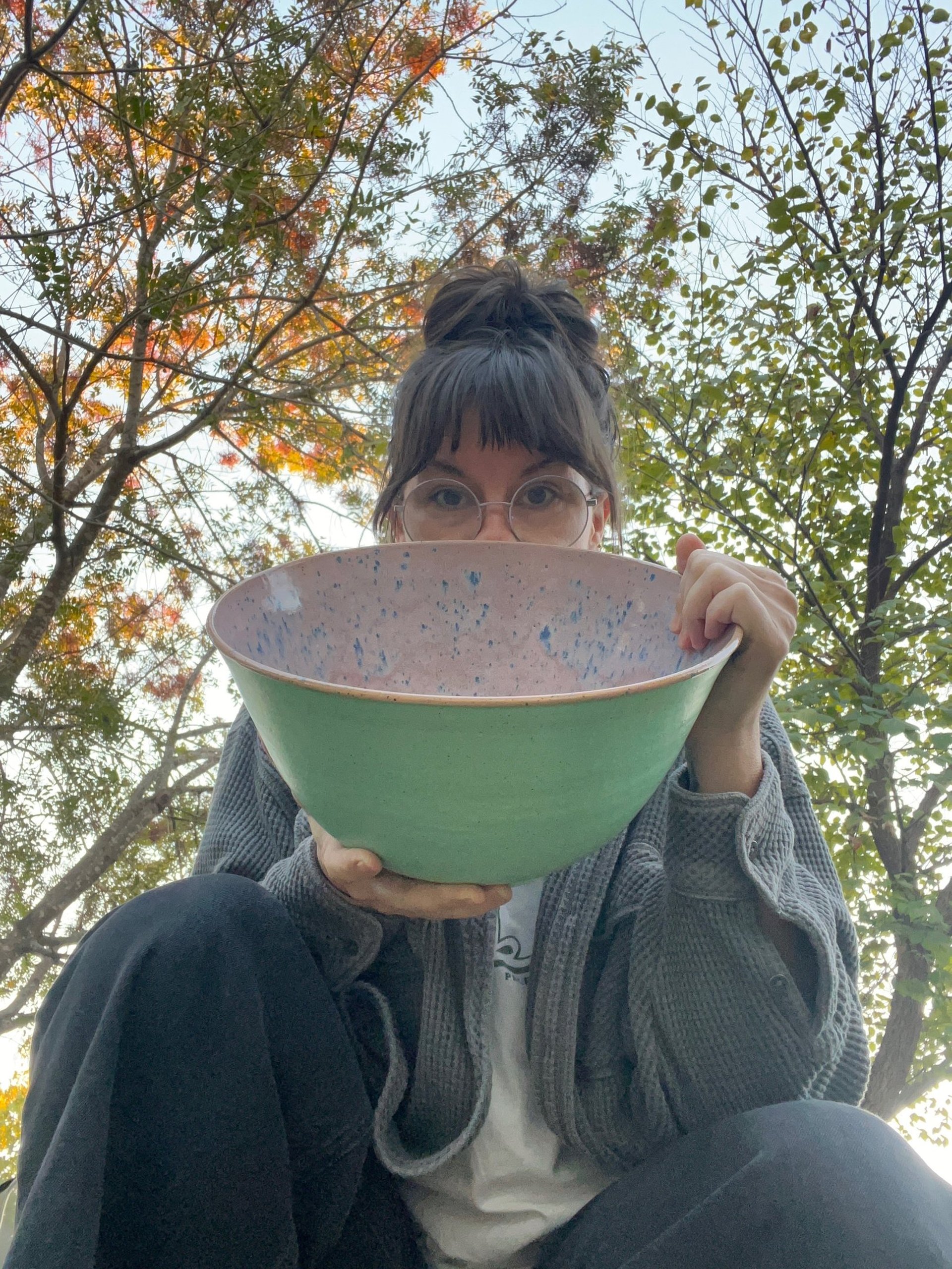 woman holding dried flower