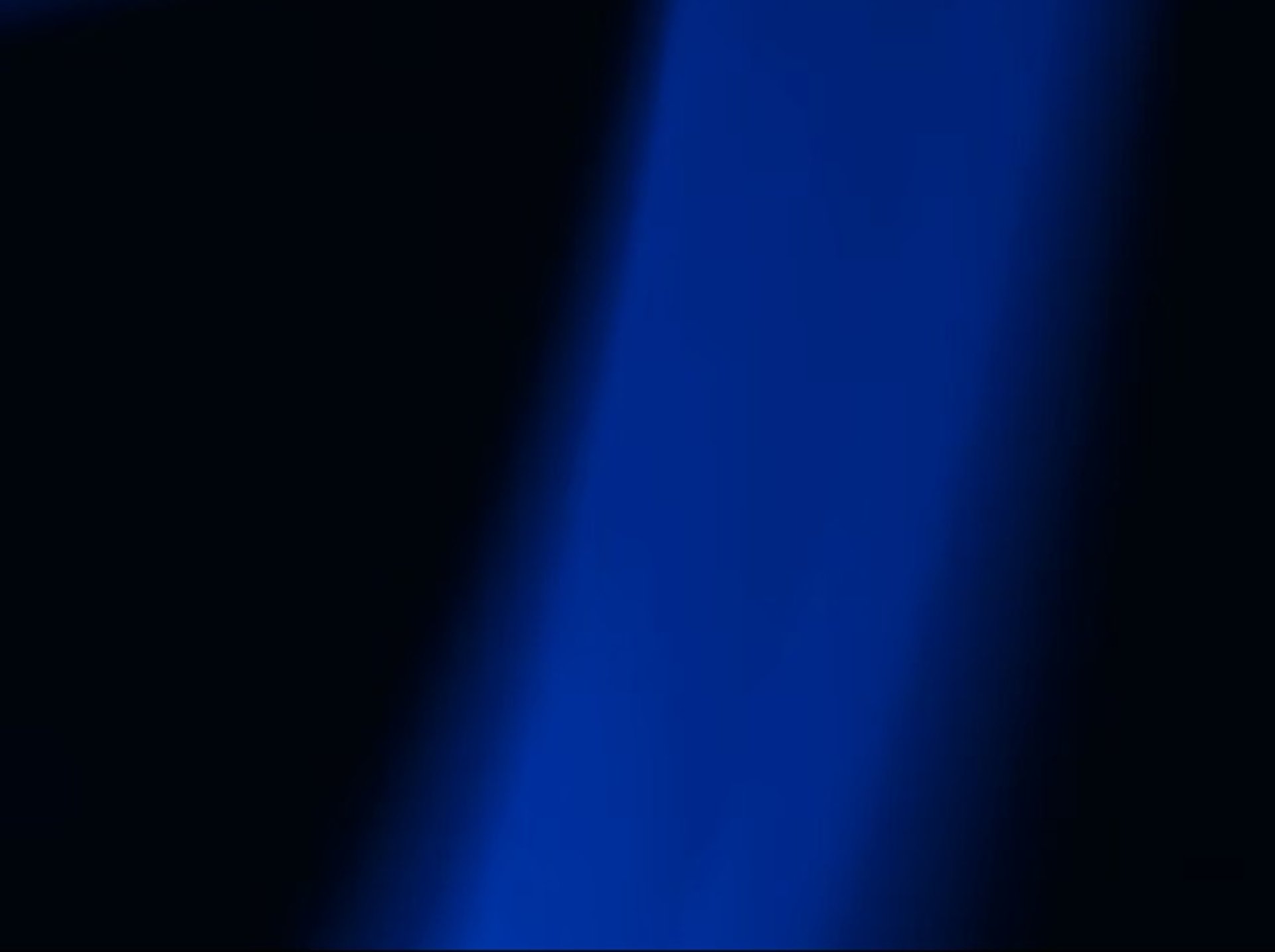 a blurry image of a blue and black background