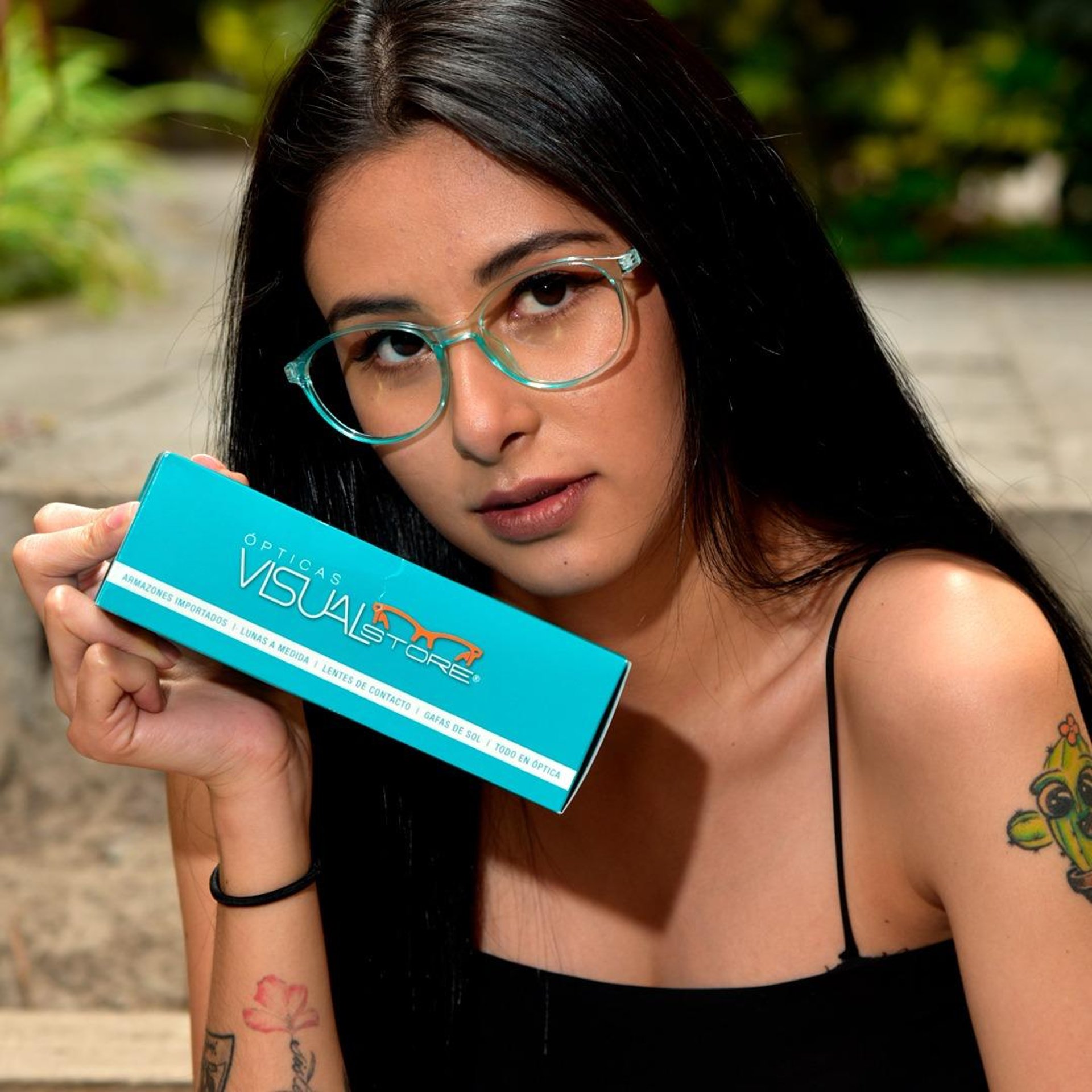 woman in blue denim jacket wearing eyeglasses