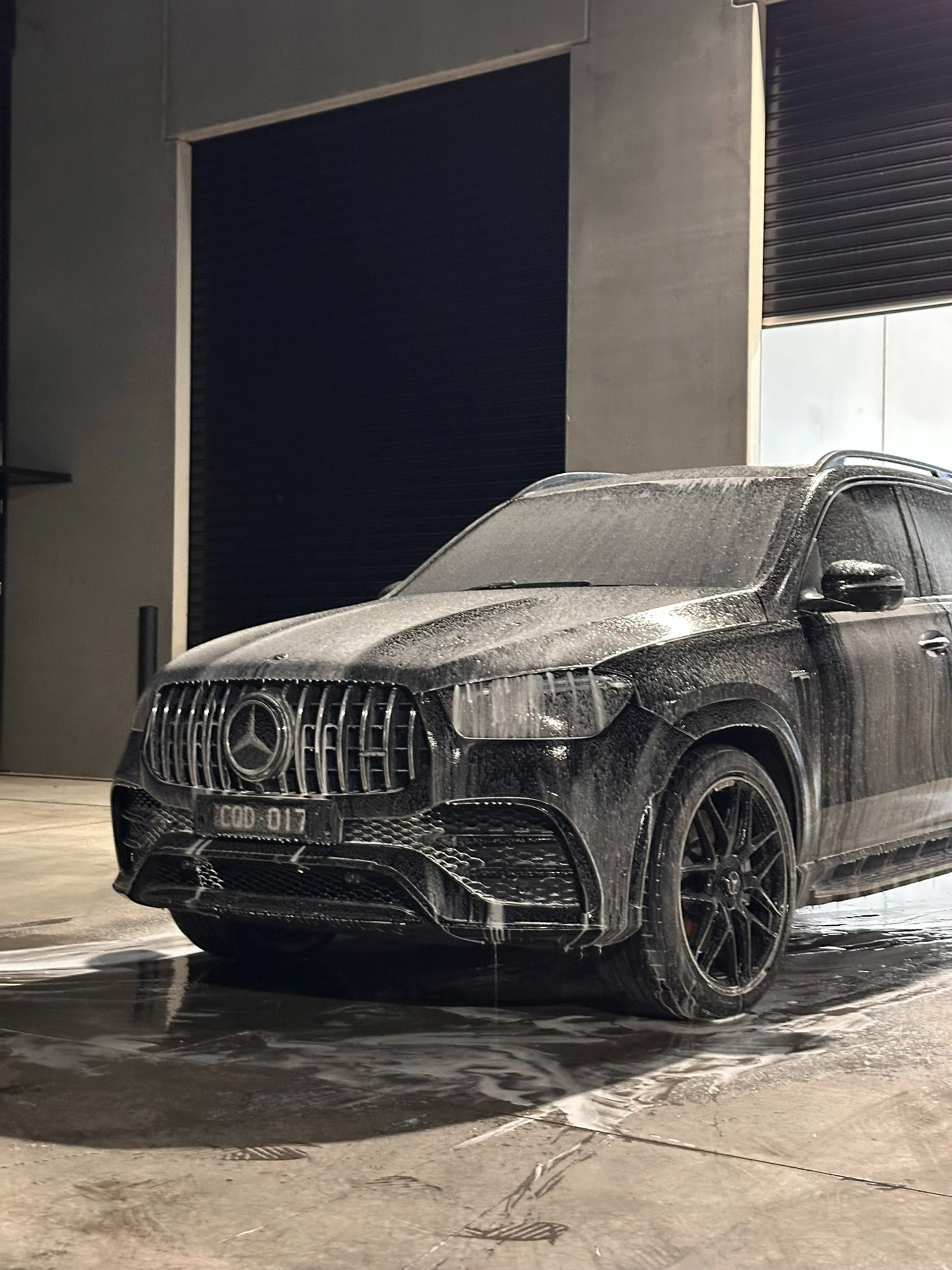 black and brown leather padded tub sofa