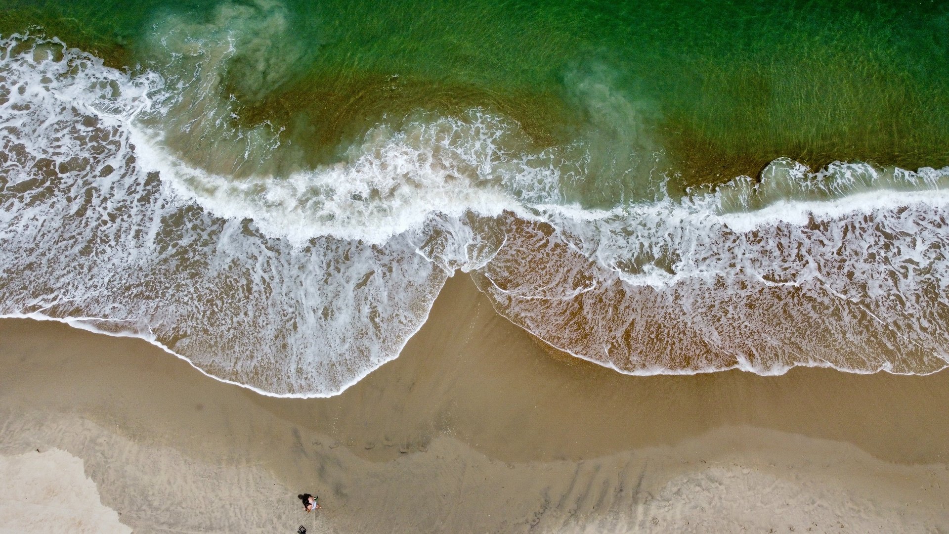 woman wearing yellow long-sleeved dress under white clouds and blue sky during daytime