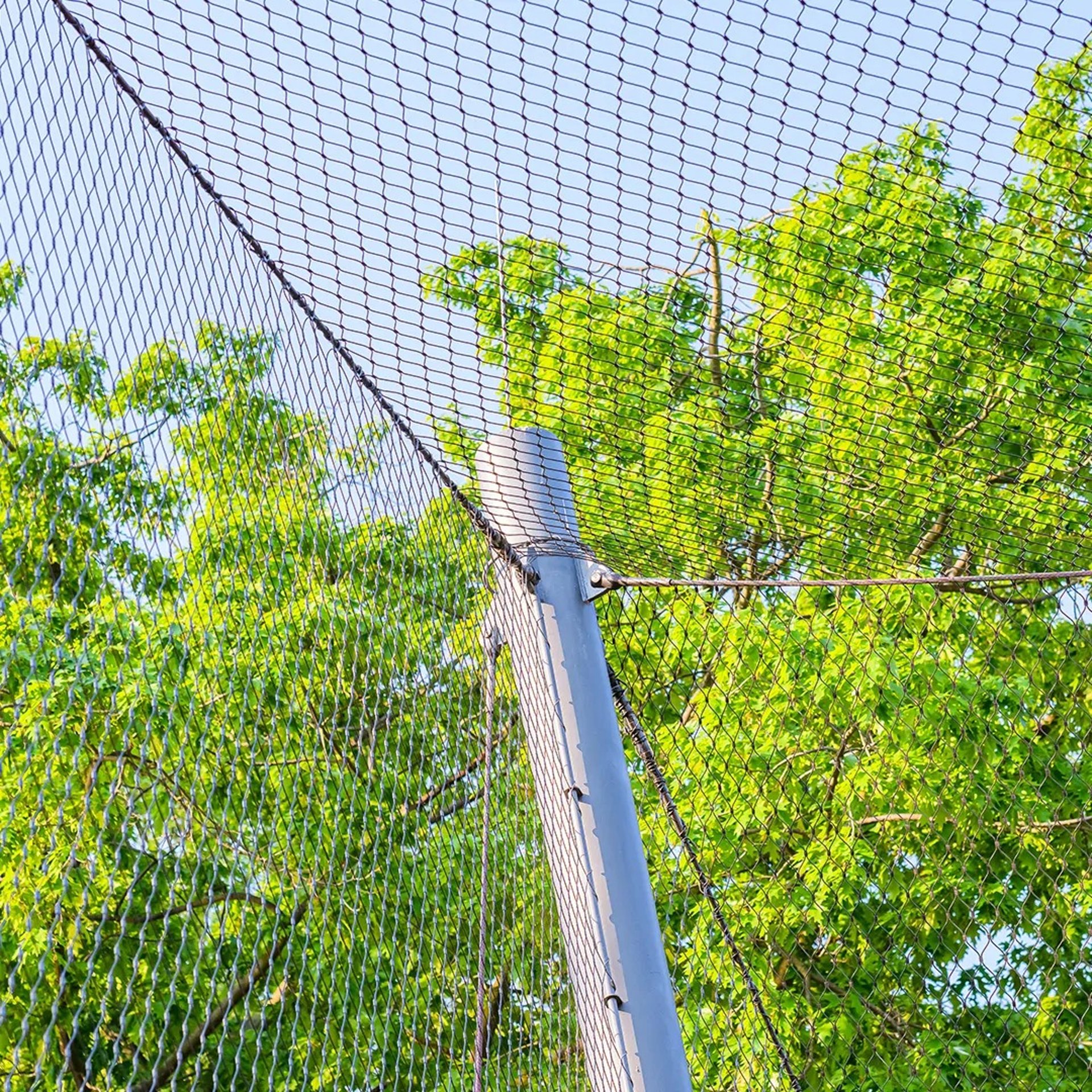 an abstract photo of a curved building with a blue sky in the background