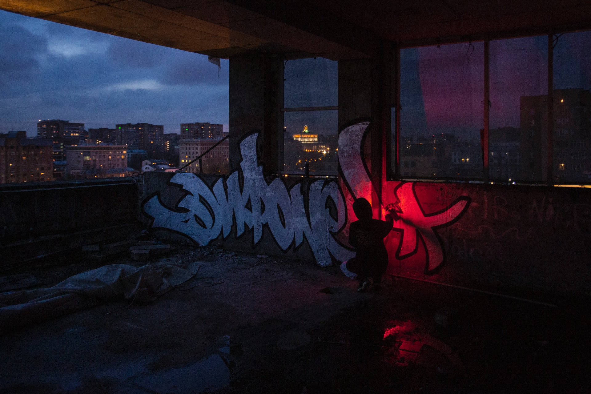 a dimly lit room with tables and chairs