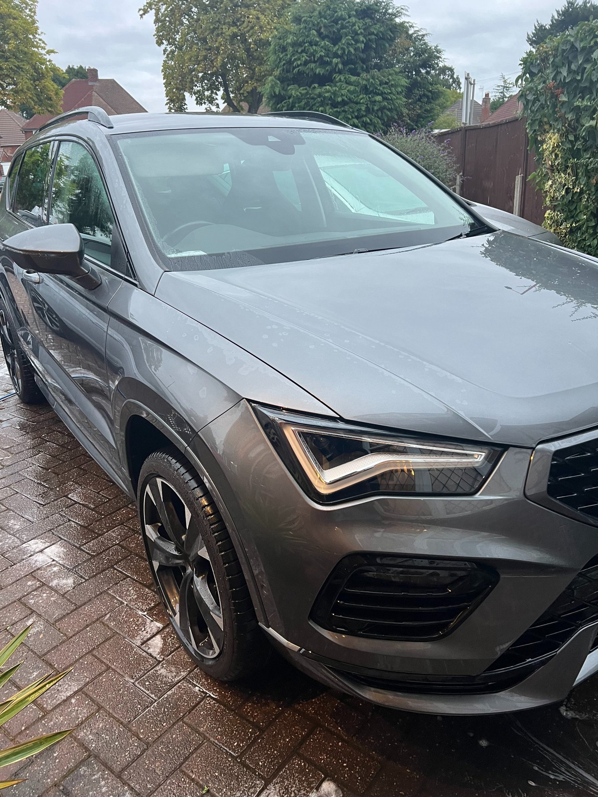 black and brown leather padded tub sofa