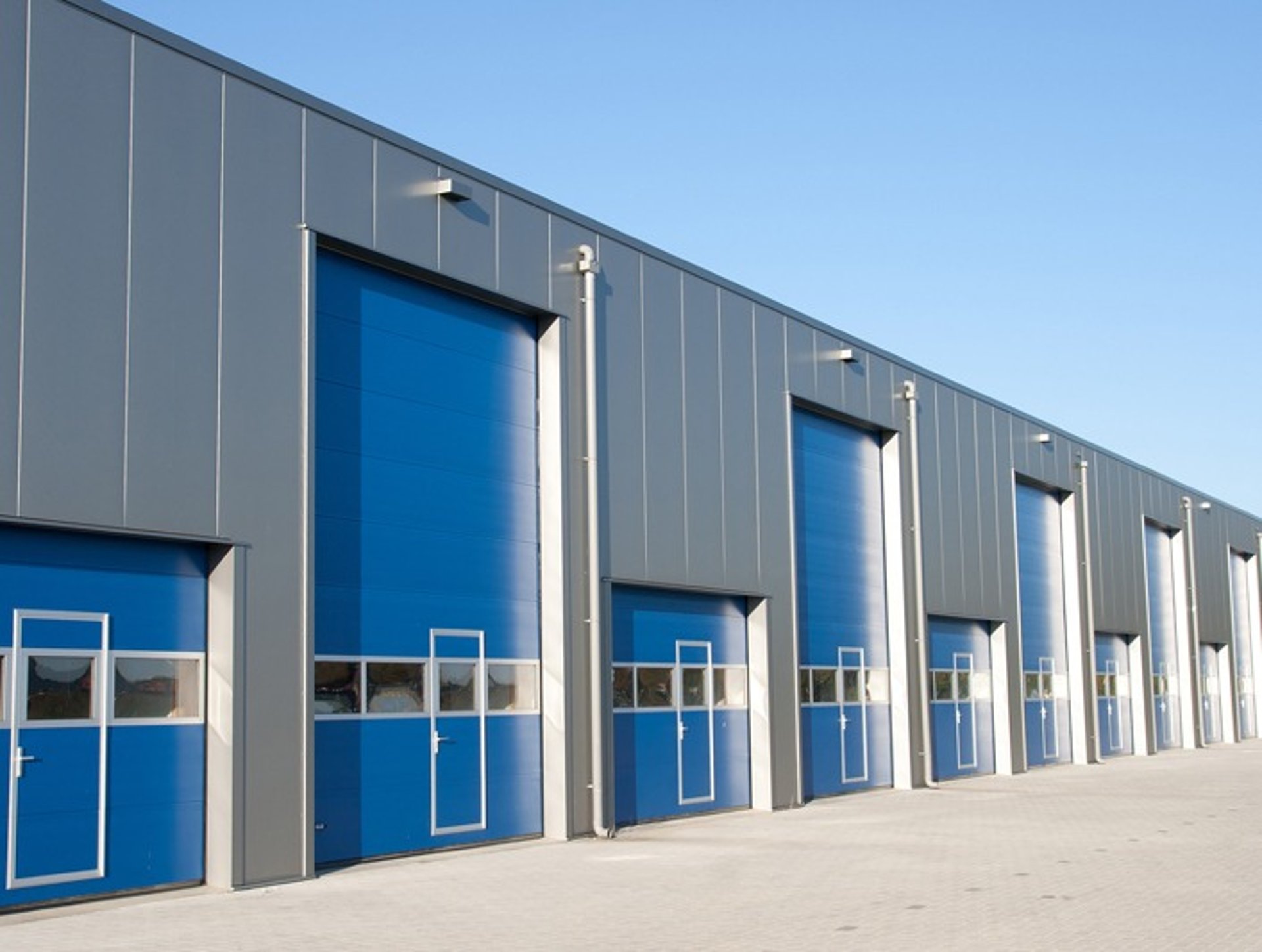 woman wearing yellow long-sleeved dress under white clouds and blue sky during daytime